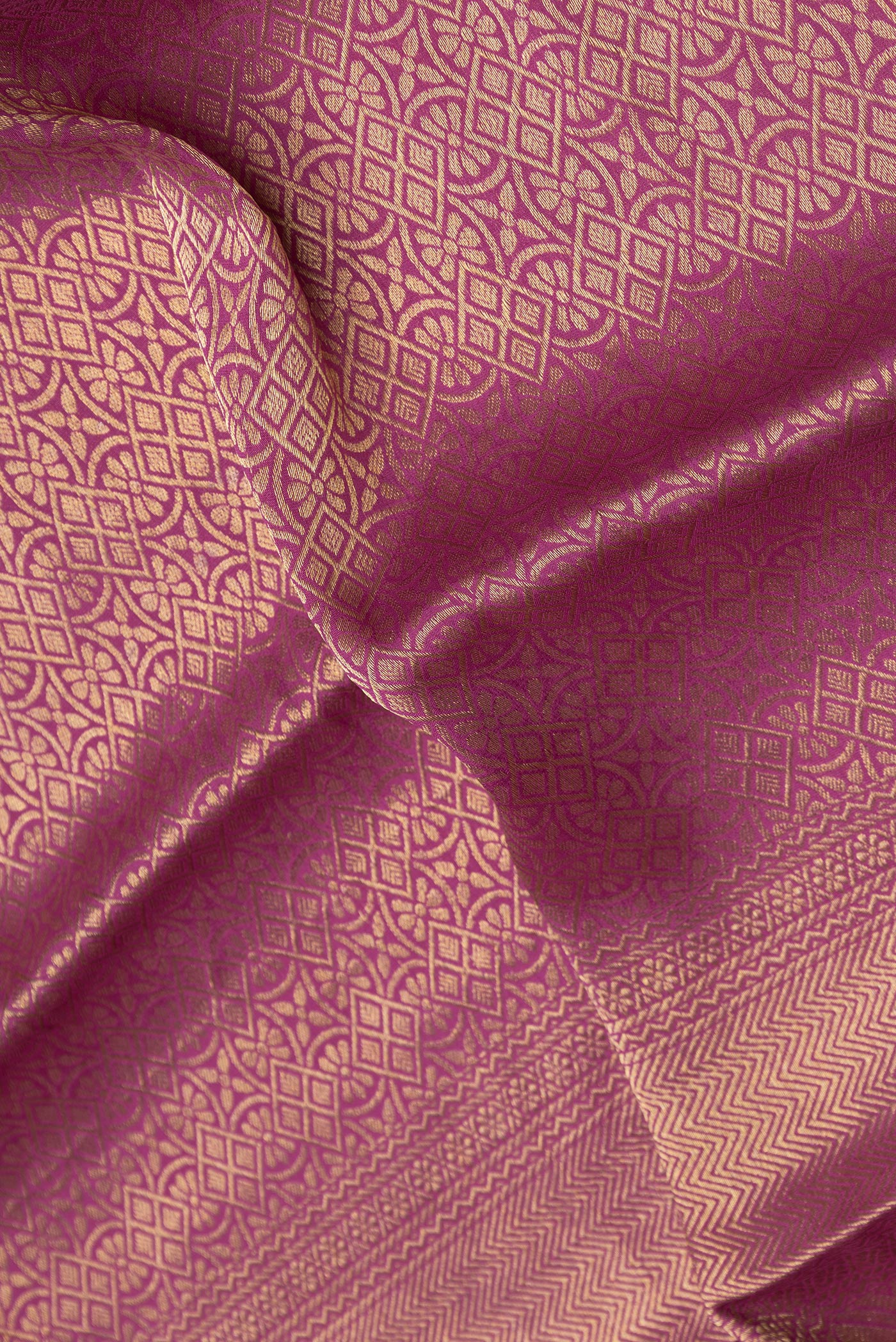 Close up of Purple Dual Tone Mysore Crepe Saree with Zari Brocade on the body and Zari Border.  displaying folds