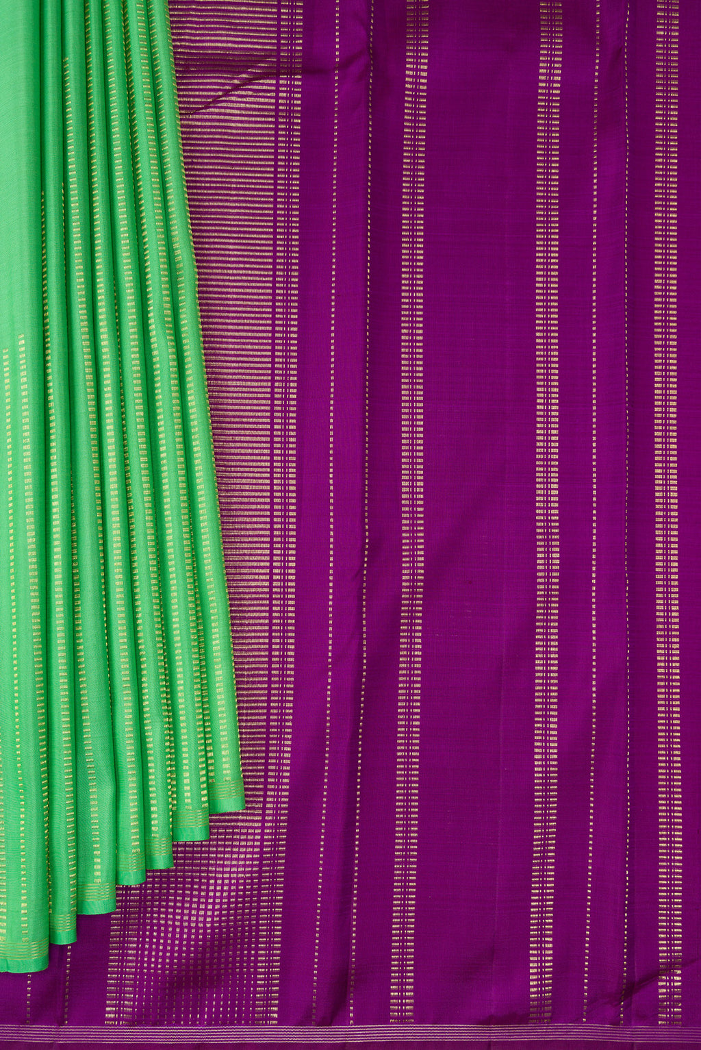 Pleats and pallu of Green Kanjivaram Silk Saree with Stripes on the body and Thin Zari Line. 