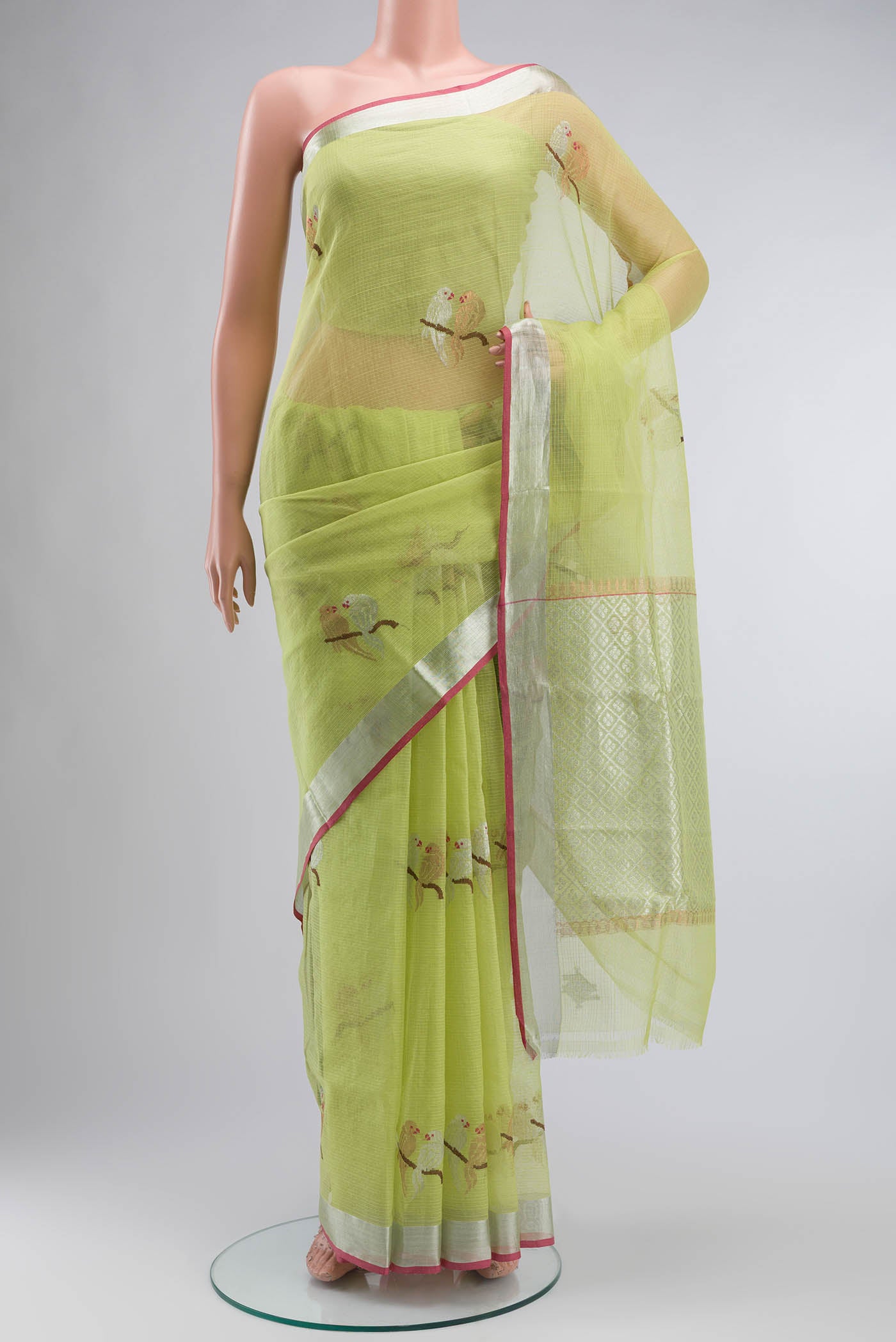 Green Kota Silk Saree with Zari Butta on the body and Zari Border displayed on a mannequin
