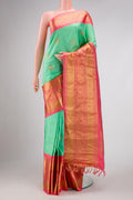 Sea Green Dual Tone Gadwal Silk Saree with Zari Butta on the body and Zari Border displayed on a mannequin