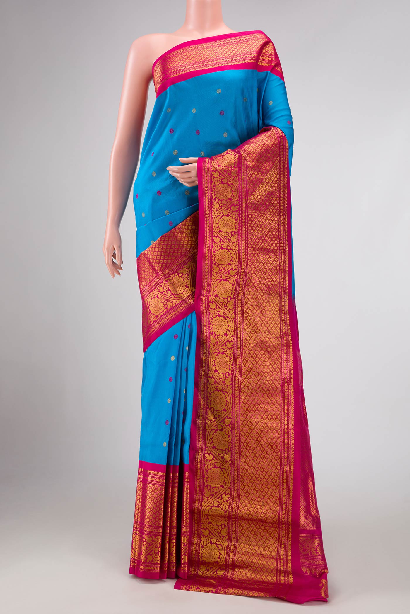 Sky Blue Dual Tone Gadwal Silk Saree with Zari And Thread Butta on the body and Zari Border displayed on a mannequin