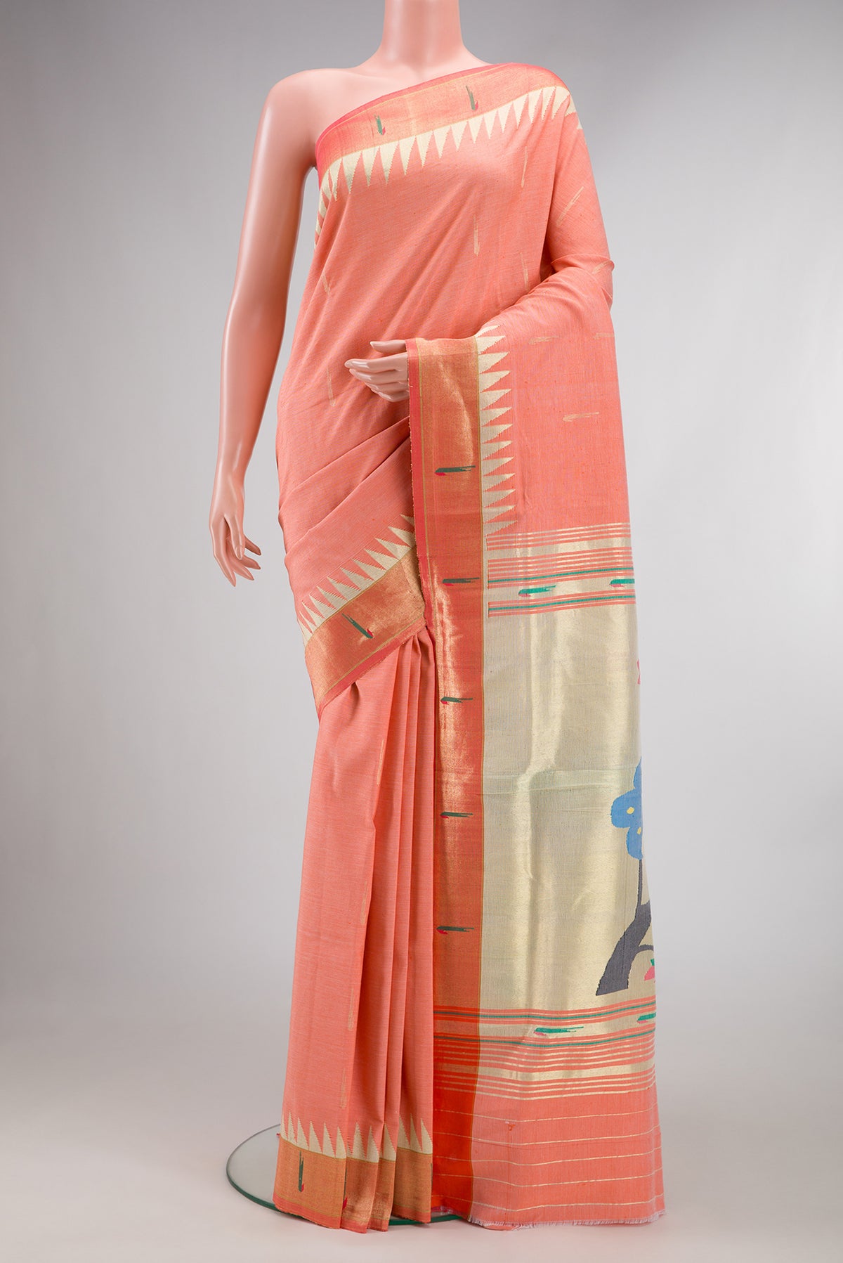 Peach Paithani Cotton Saree with Zari Butta on the body and Paithani Border.  displayed on a mannequin