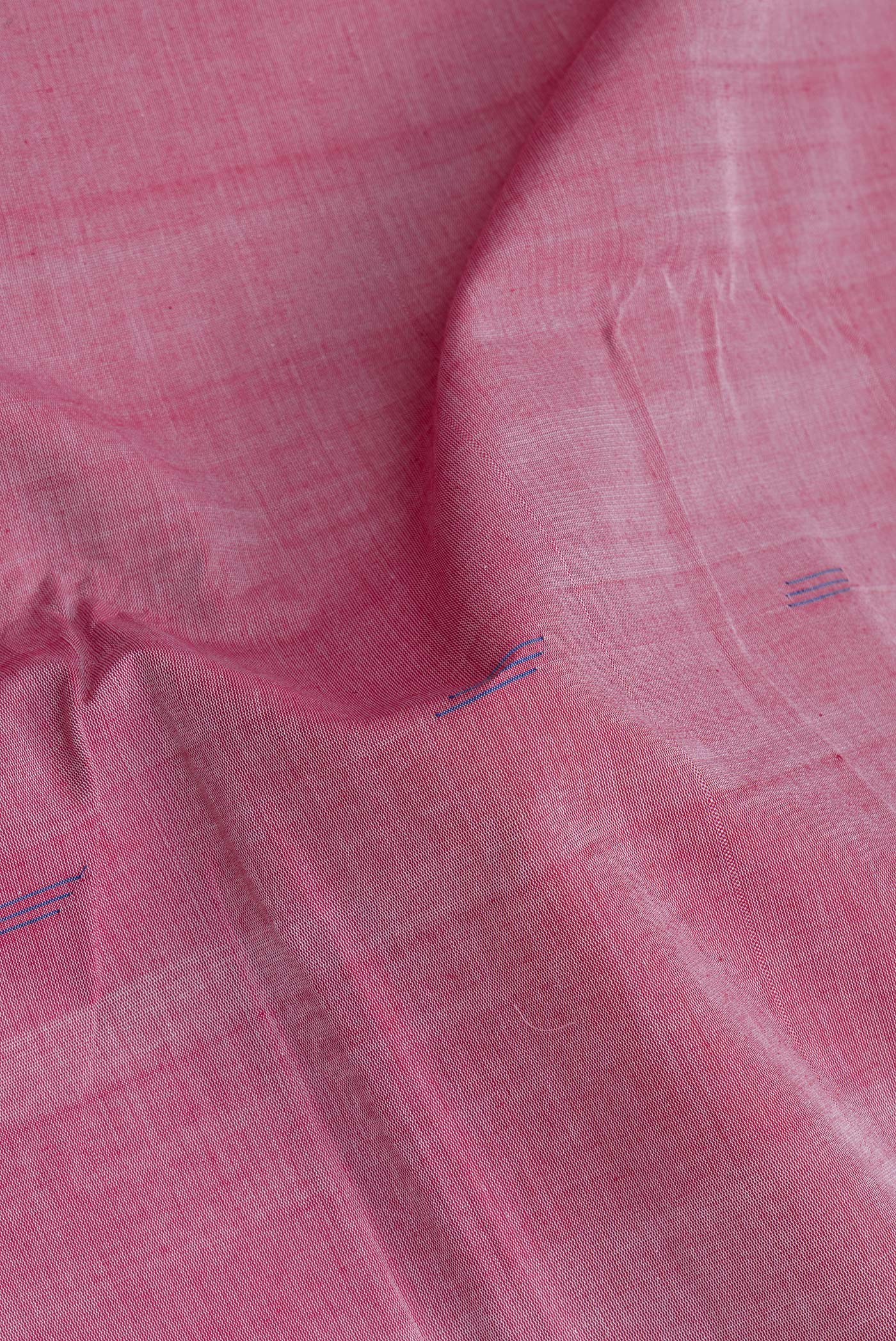 Close up of Pink Uppada Cotton Saree with Zari Butta on the body and Zari Border.  displaying folds