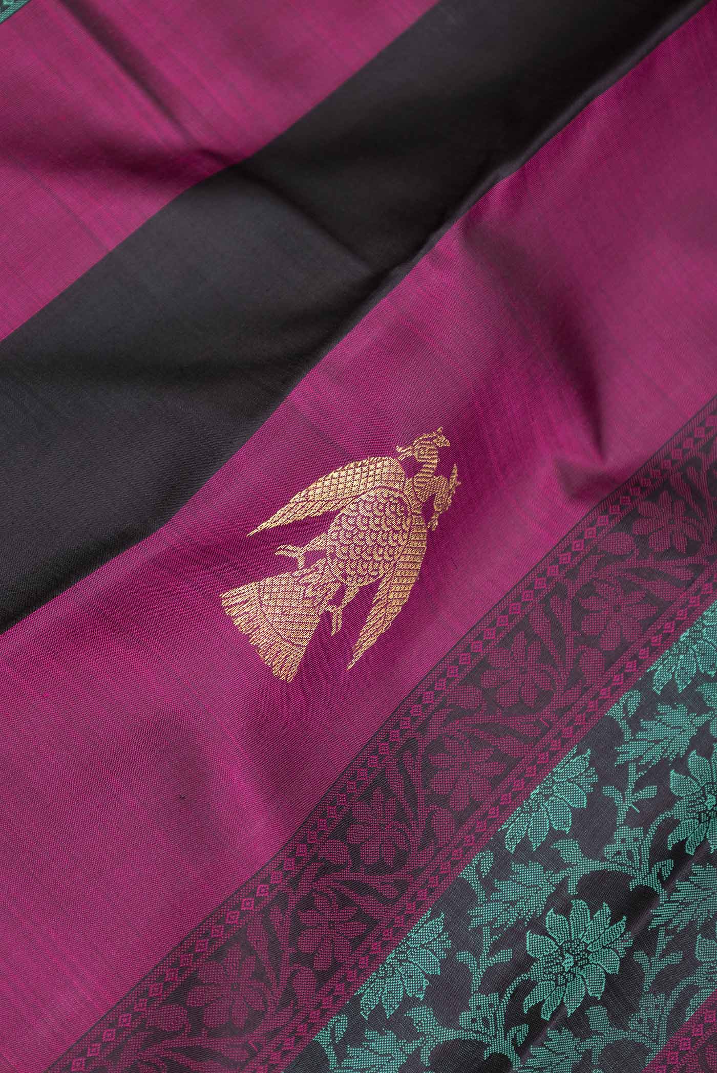 Close up of Green and Pink Color Kanchipuram Silk Saree with Jacquard design on the body and Without Border displaying folds