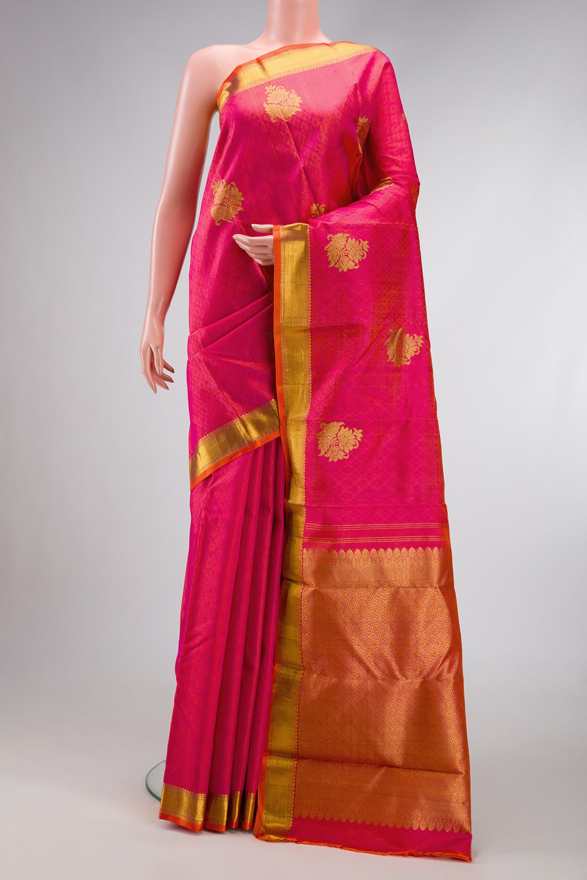 Coral Dual Tone Kanchipuram Silk Saree with Jacquard With Zari Butta on the body and Zari Border.  displayed on a mannequin