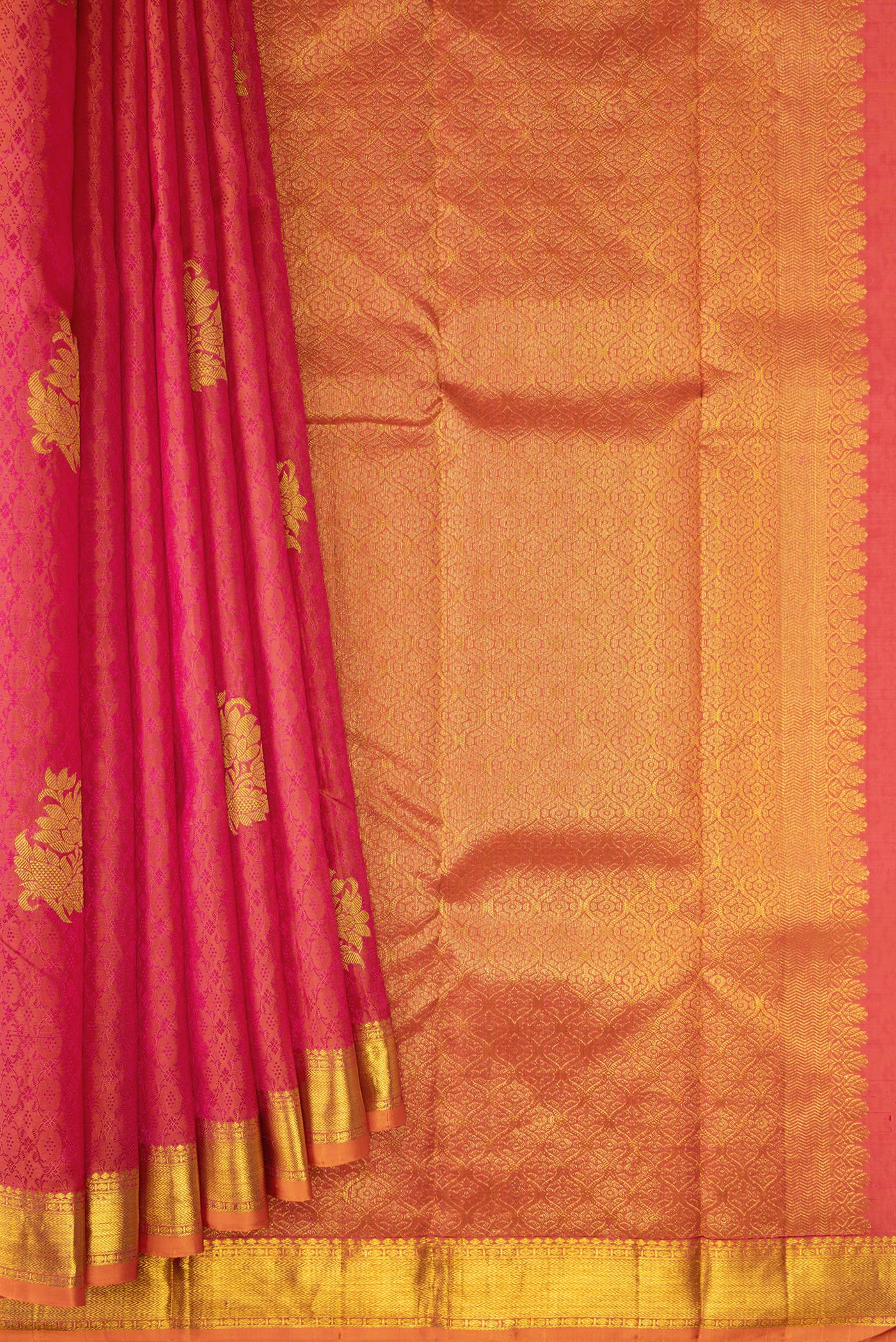 Pleats and pallu of Coral Dual Tone Kanchipuram Silk Saree with Jacquard With Zari Butta on the body and Zari Border. 