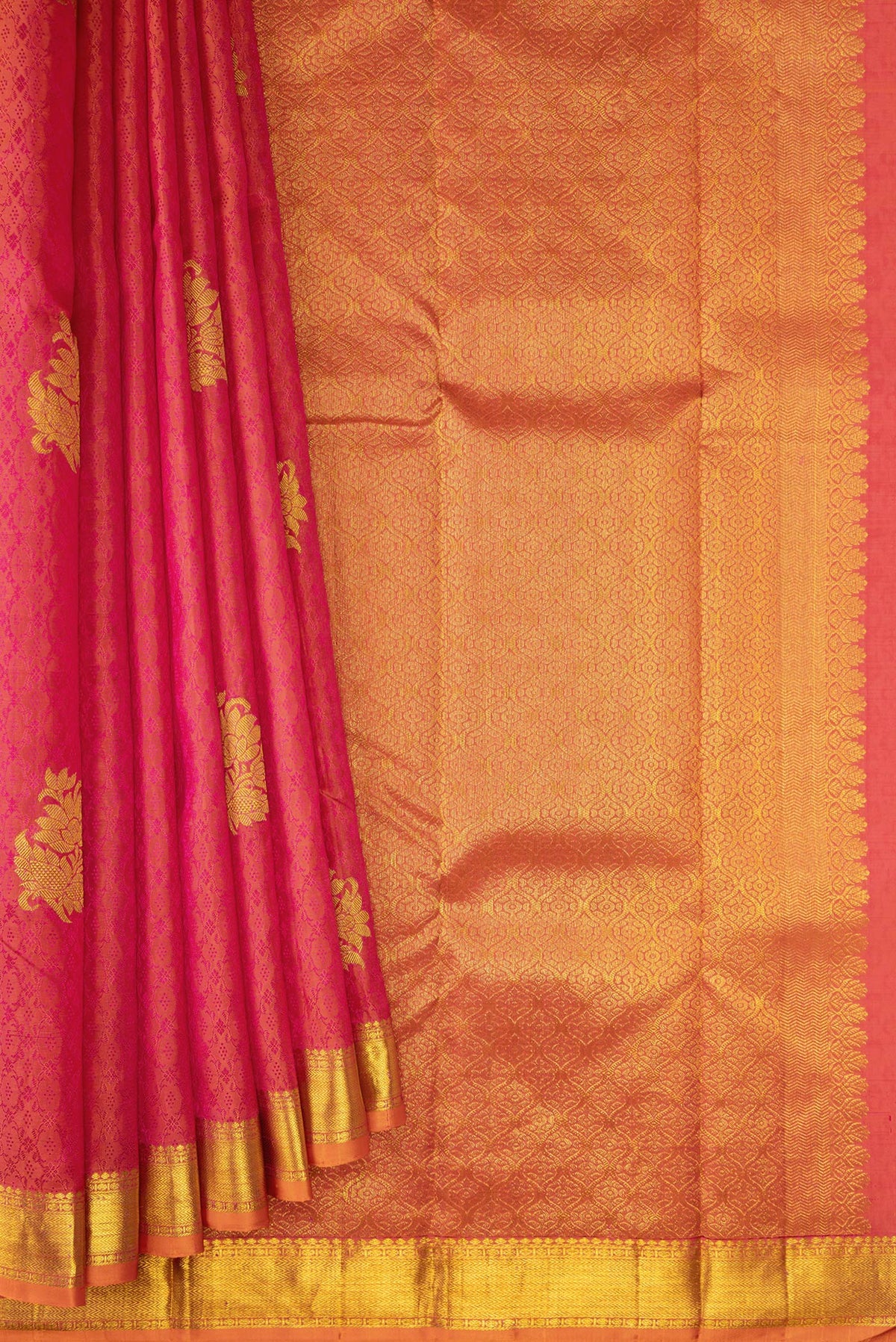 Pleats and pallu of Coral Dual Tone Kanchipuram Silk Saree with Jacquard With Zari Butta on the body and Zari Border. 