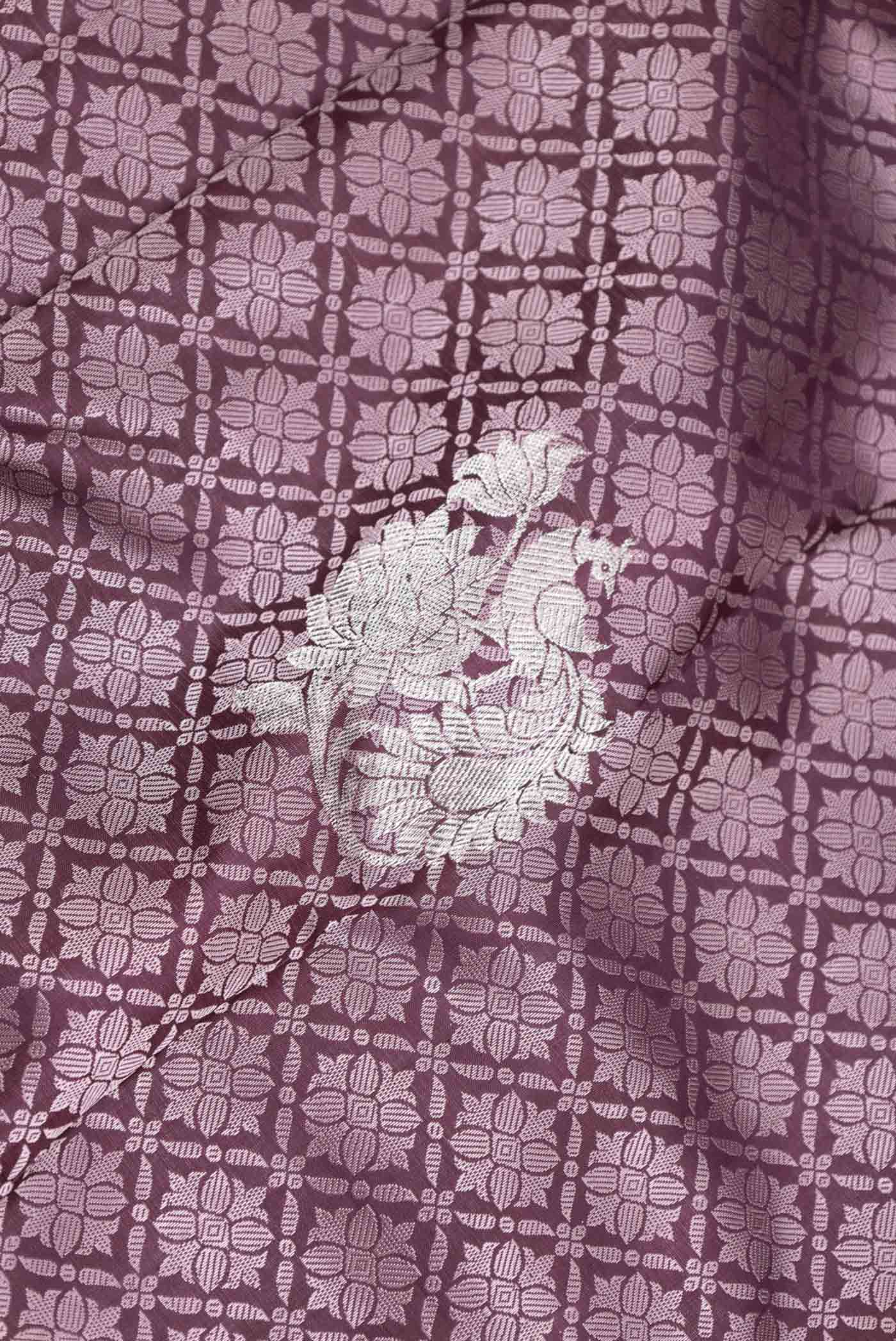 Close up of Burgundy Dual Tone Kanchipuram Silk Saree with Jacquard With Zari Butta on the body and Zari Border displaying folds