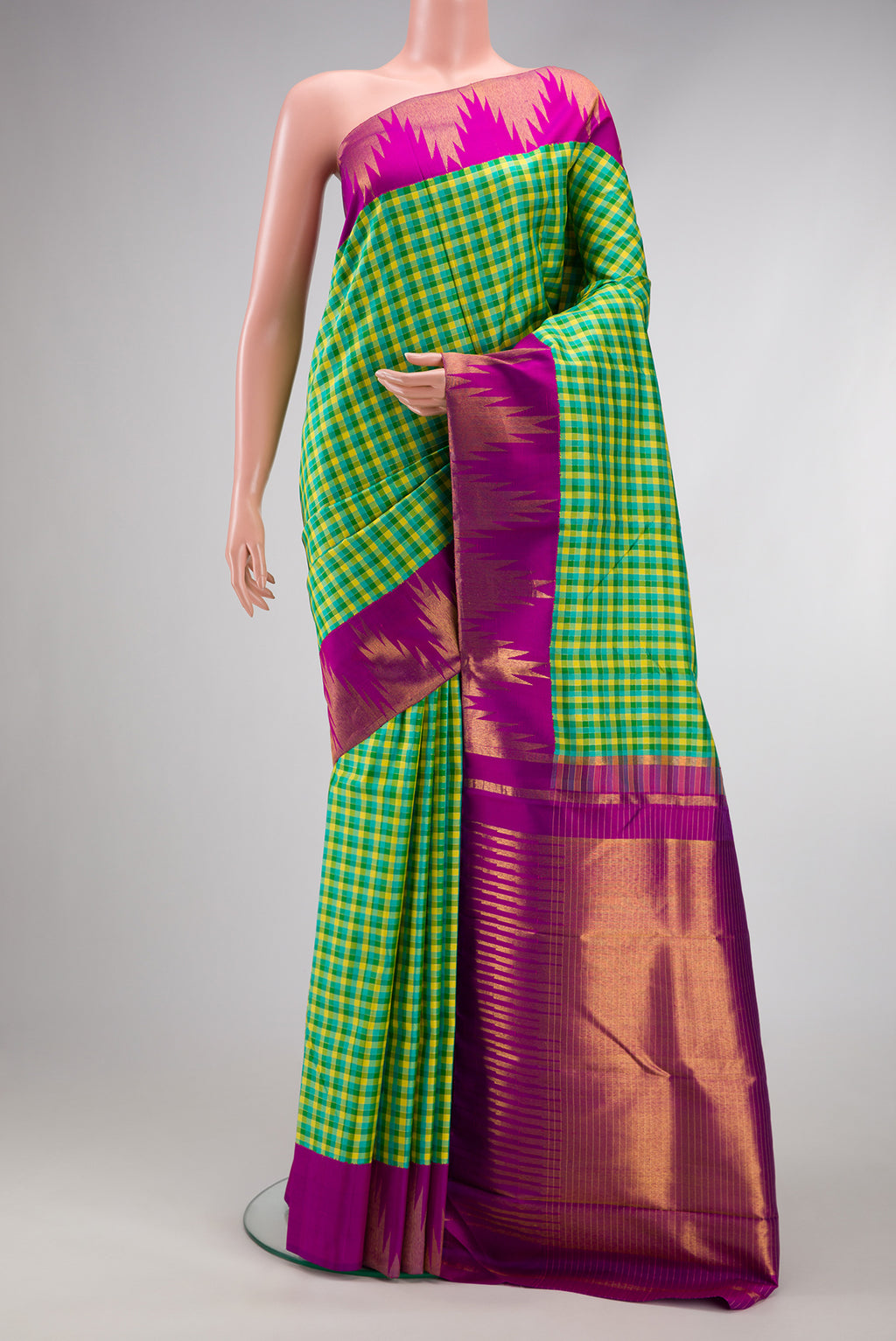 Green Dual Tone Kanjivaram Silk Saree with Checked design on the body and Temple Border.  displayed on a mannequin