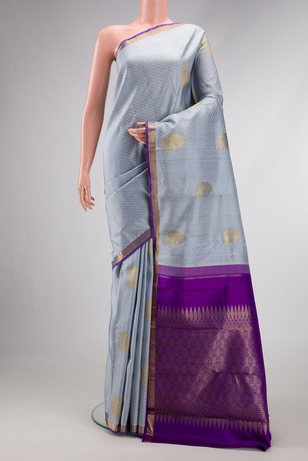 Pure Silk Pure Zari Grey Dual Tone Kanjivaram Saree with Jacquard With Zari Butta on the body and Zari Border.  displayed on a mannequin