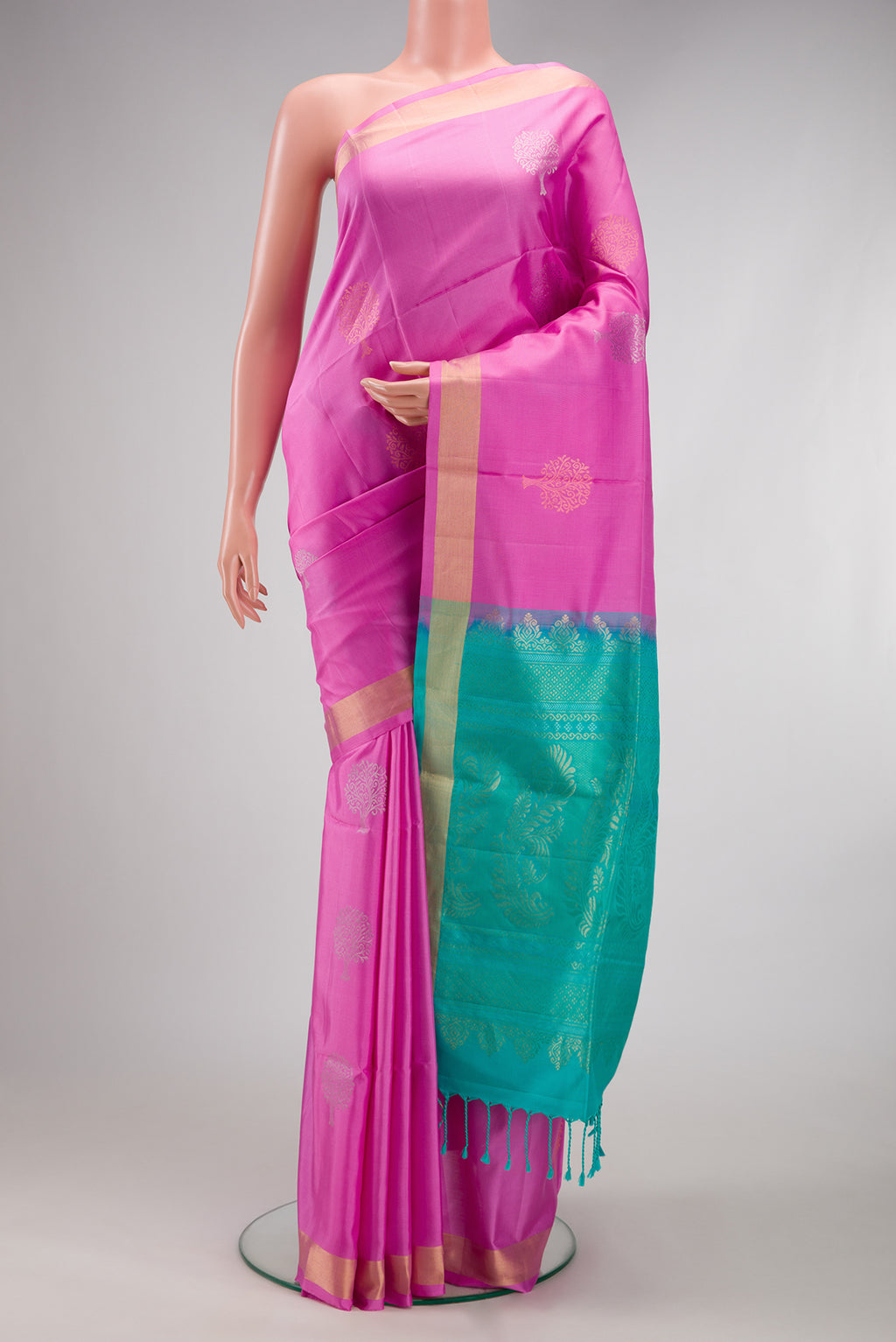 Pink Soft Silk Saree with Zari Butta on the body and Zari Border.  displayed on a mannequin