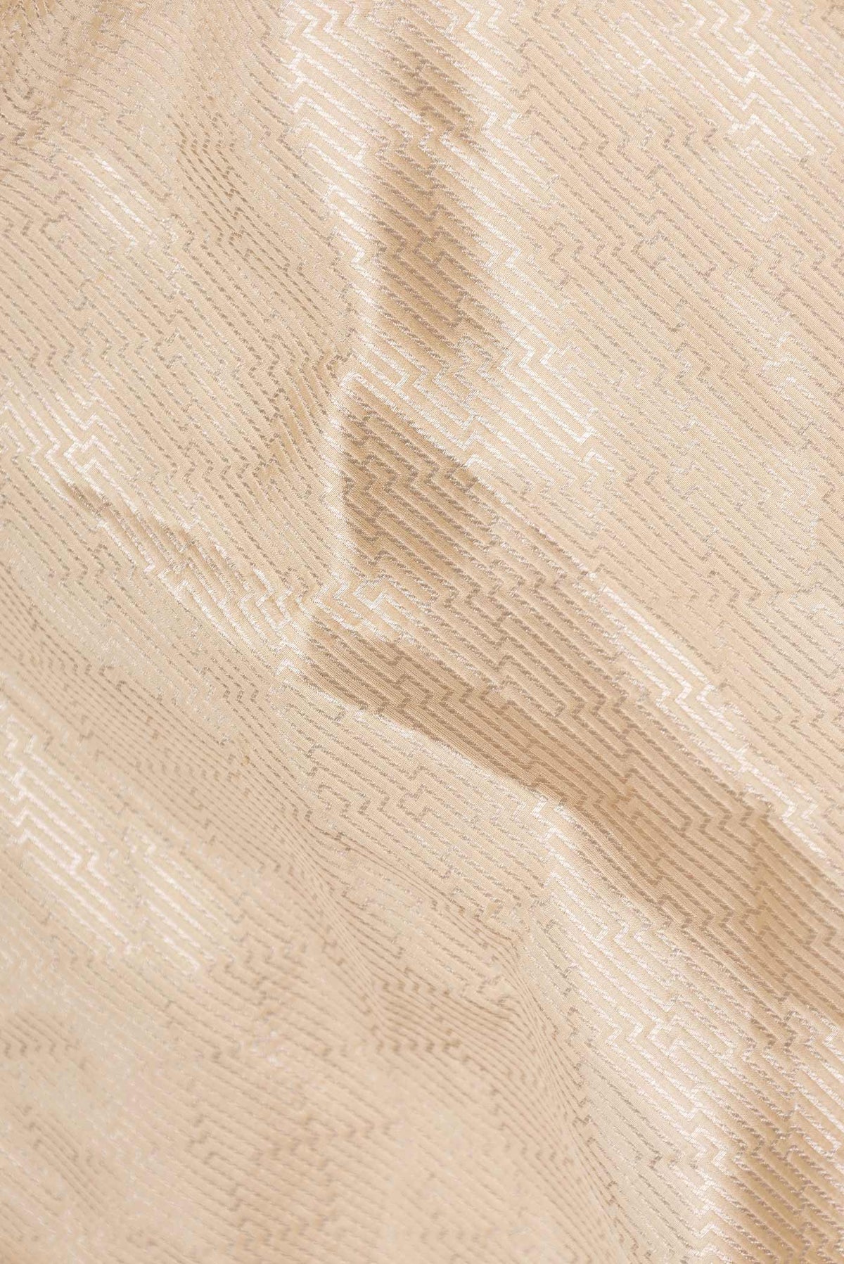 Close up of Beige Dual Tone Banarasi Saree with Zari Brocade on the body and Zari Border displaying folds