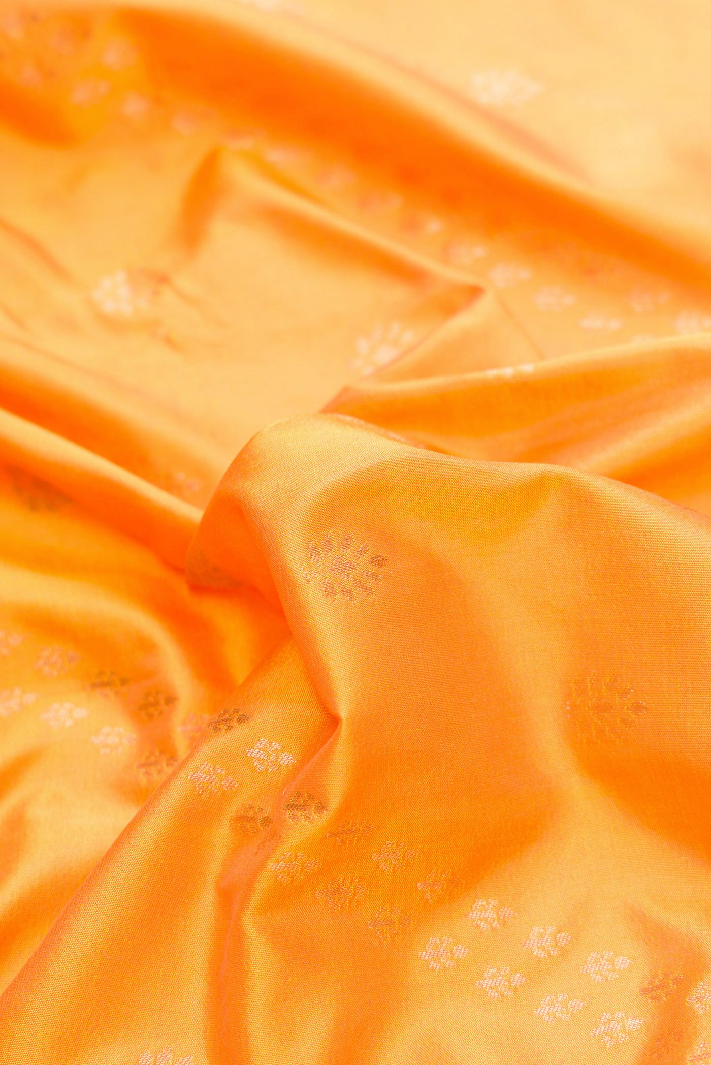 Close up of Mustard Dual Tone Paithani Silk Saree with Zari Butta on the body and Zari Border.  displaying folds
