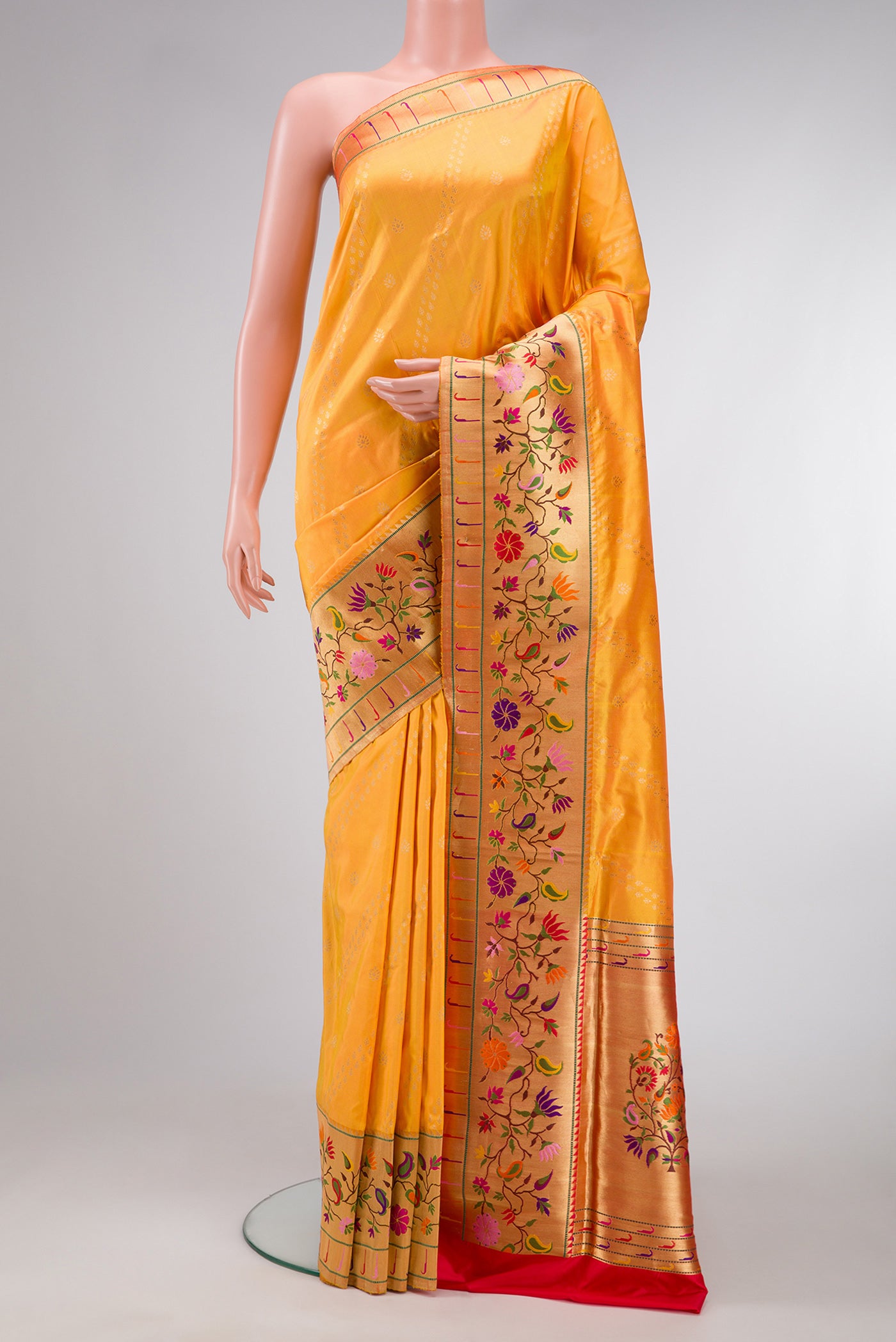 Mustard Dual Tone Paithani Silk Saree with Zari Butta on the body and Zari Border.  displayed on a mannequin