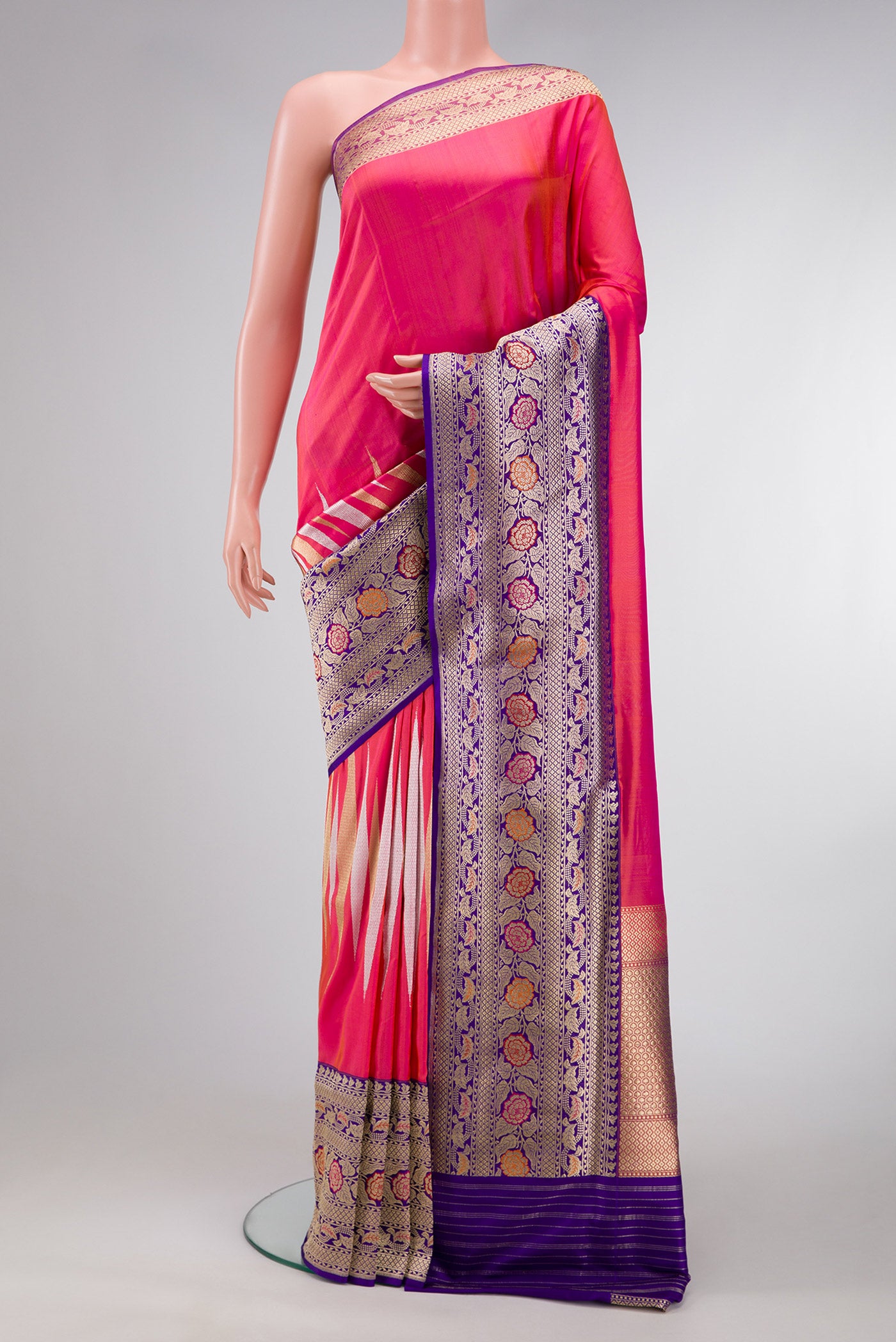 Coral Dual Tone Banarasi Silk Saree with Zari Butta on the body and Zari Border.  displayed on a mannequin