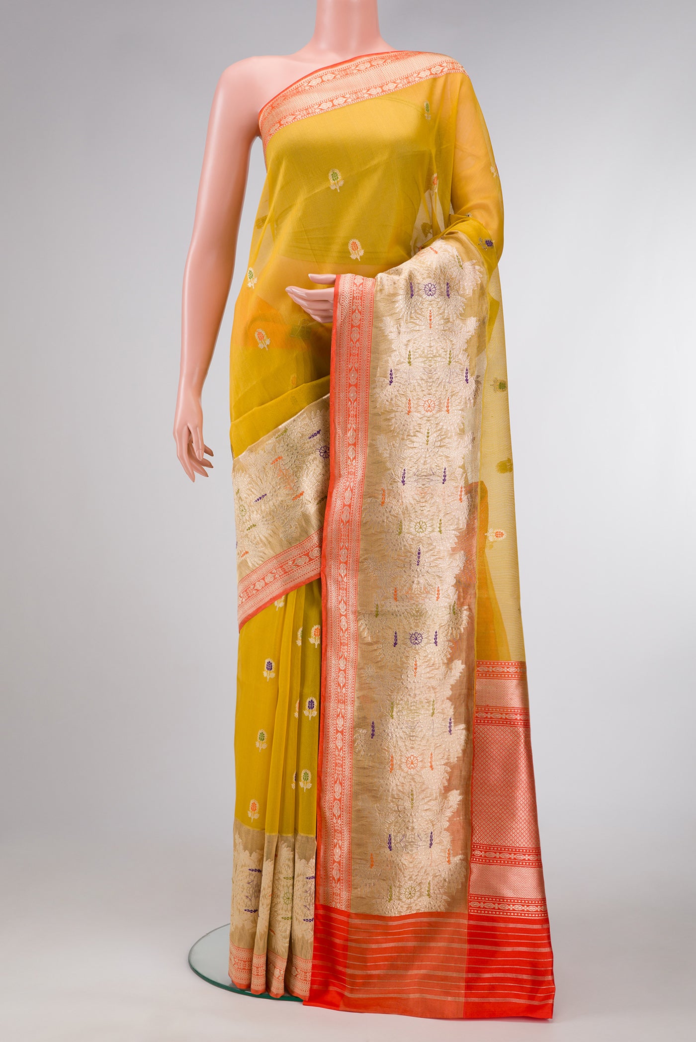 Mehandi Green Dual Tone Organza Silk Saree with Zari And Thread Butta on the body and Zari Border.  displayed on a mannequin