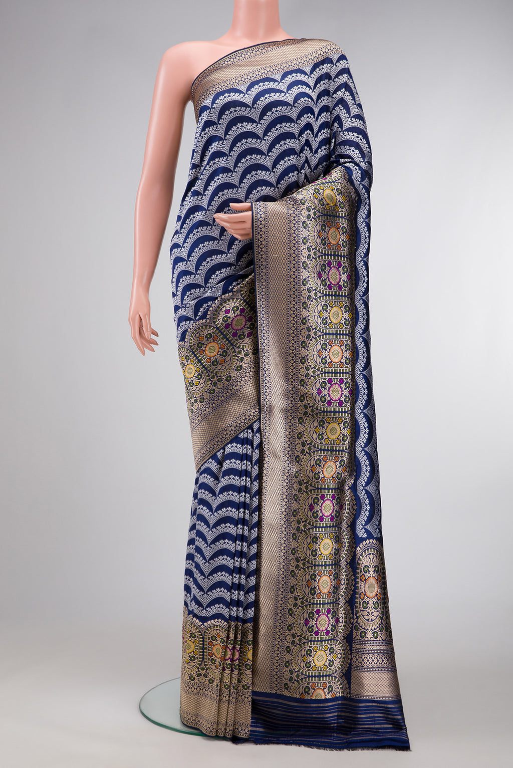 Navy Blue Dual Tone Banarasi Silk Saree with Stripes on the body and Zari Border.  displayed on a mannequin