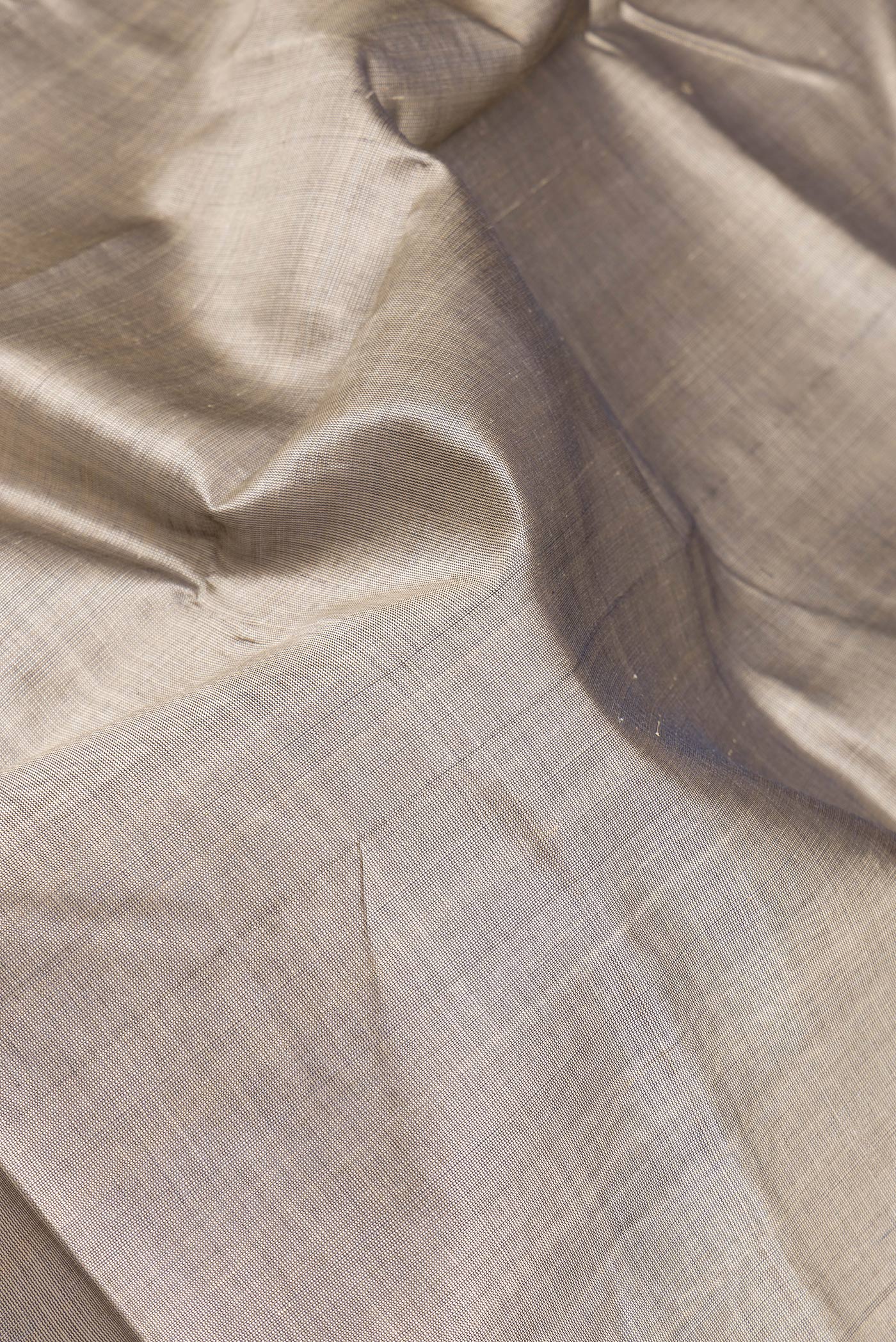 Close up of Grey Double Ikat Saree with Plain Body and Temple Border.  displaying folds