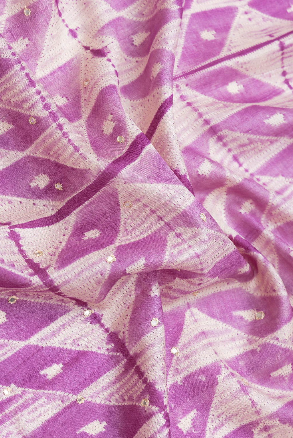 Close up of Purple Dual Tone Tussar Silk Saree with Embroidery on the body and Embroidery Border.  displaying folds