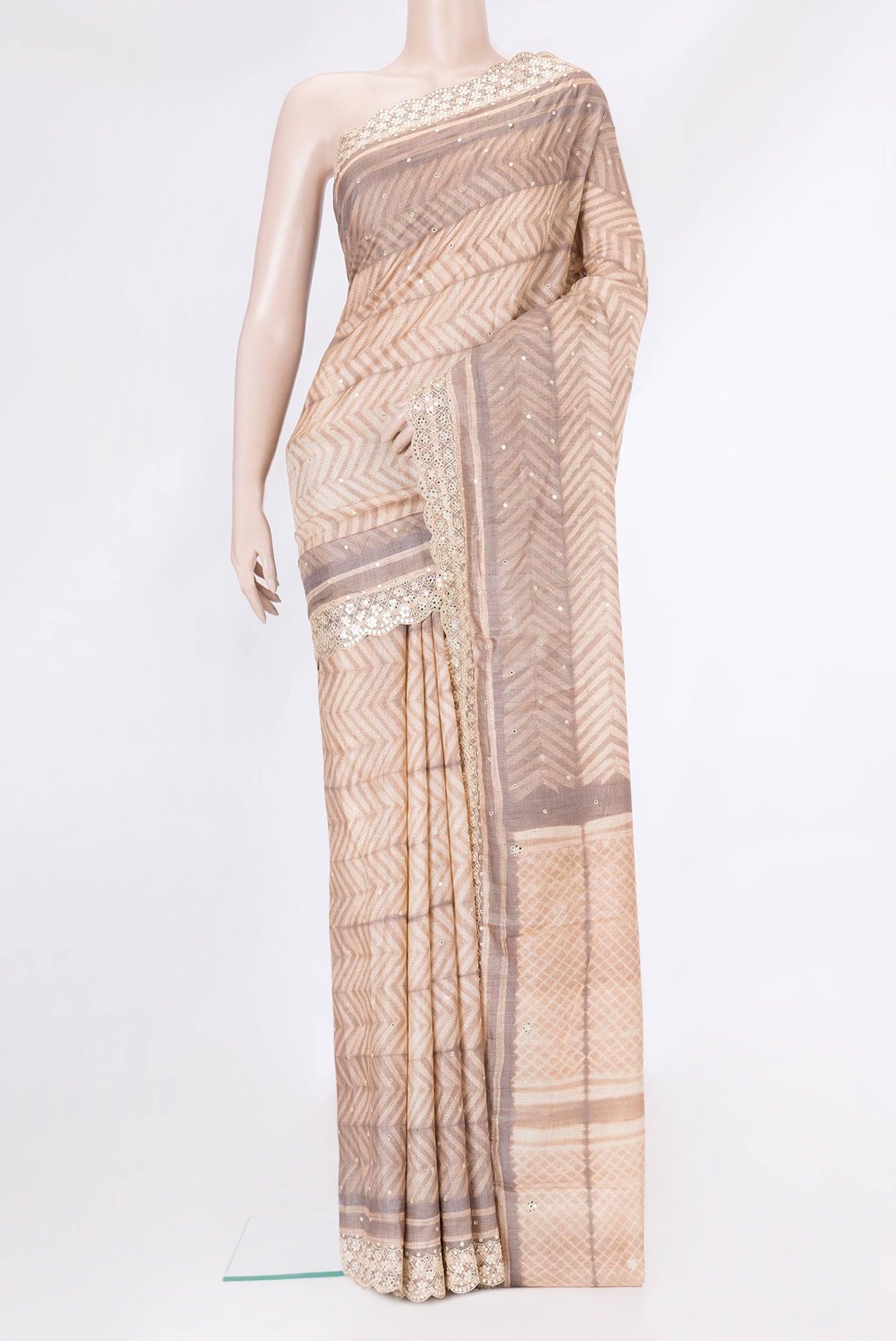 Golden Peach Dual Tone Tussar Silk Saree with Embroidery on the body and Embroidery Border.  displayed on a mannequin
