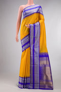 Pure Silk Pure Zari Yellow Kanjivaram Saree with Checked design on the body and Temple Border.  displayed on a mannequin