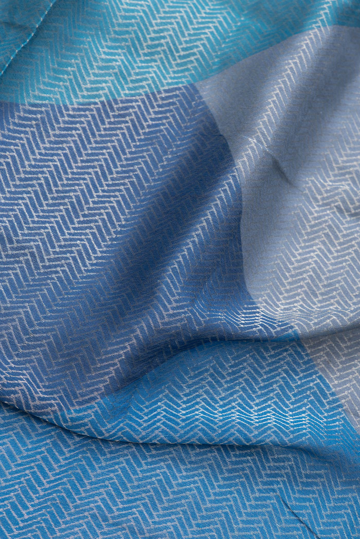 Close up of Navy Blue Dual Tone Georgette Saree with Zari Brocade on the body and Zari Border.  displaying folds