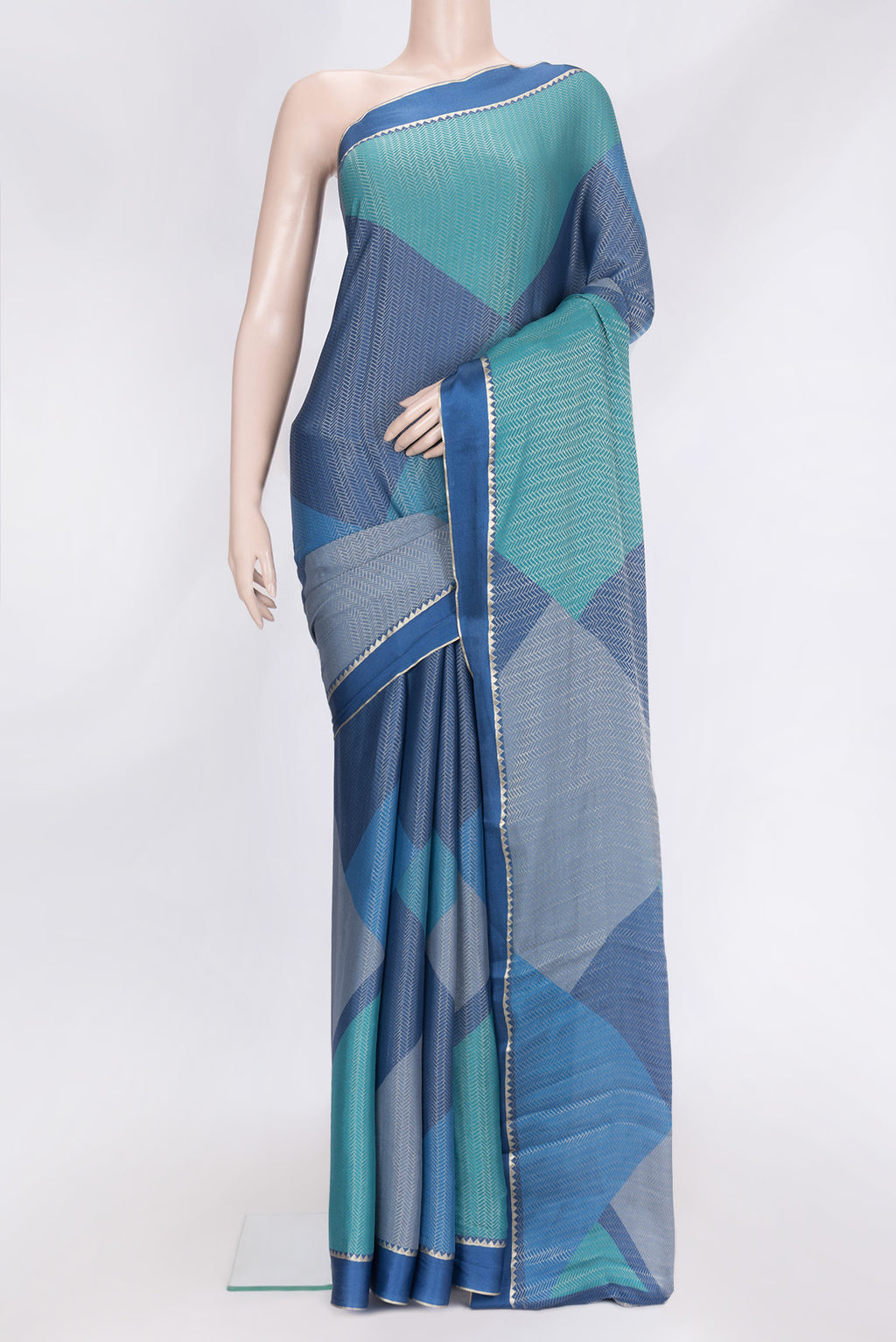 Navy Blue Dual Tone Georgette Saree with Zari Brocade on the body and Zari Border.  displayed on a mannequin