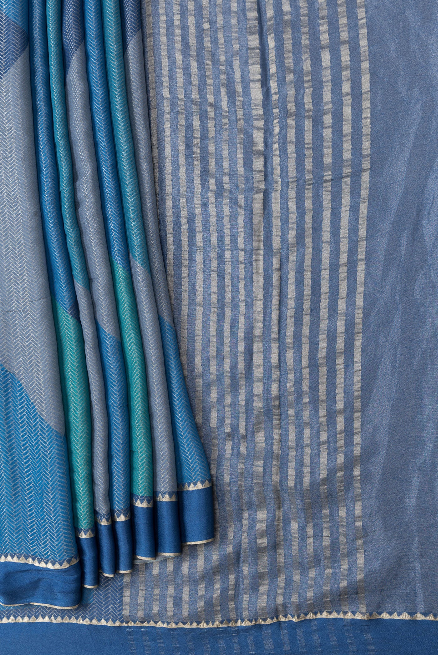 Pleats and pallu of Navy Blue Dual Tone Georgette Saree with Zari Brocade on the body and Zari Border. 