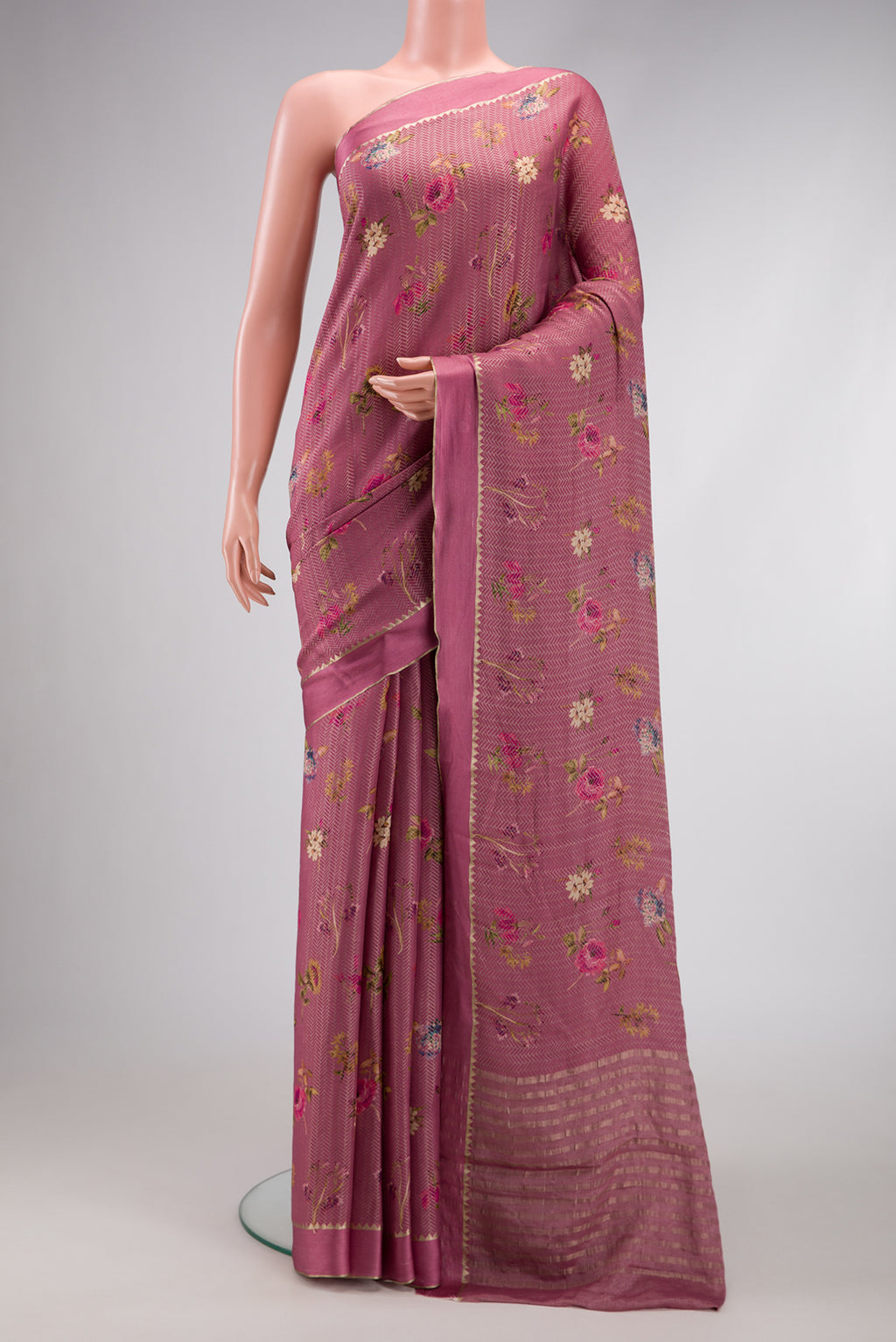 Rose Gold Dual Tone Mysore Crepe Saree with Printed design on the body and Zari Border.  displayed on a mannequin