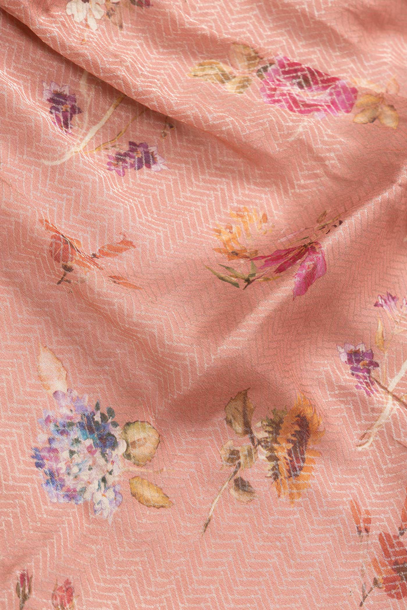 Close up of Peach Dual Tone Georgette Saree with Zari Brocade on the body and Zari Border.  displaying folds