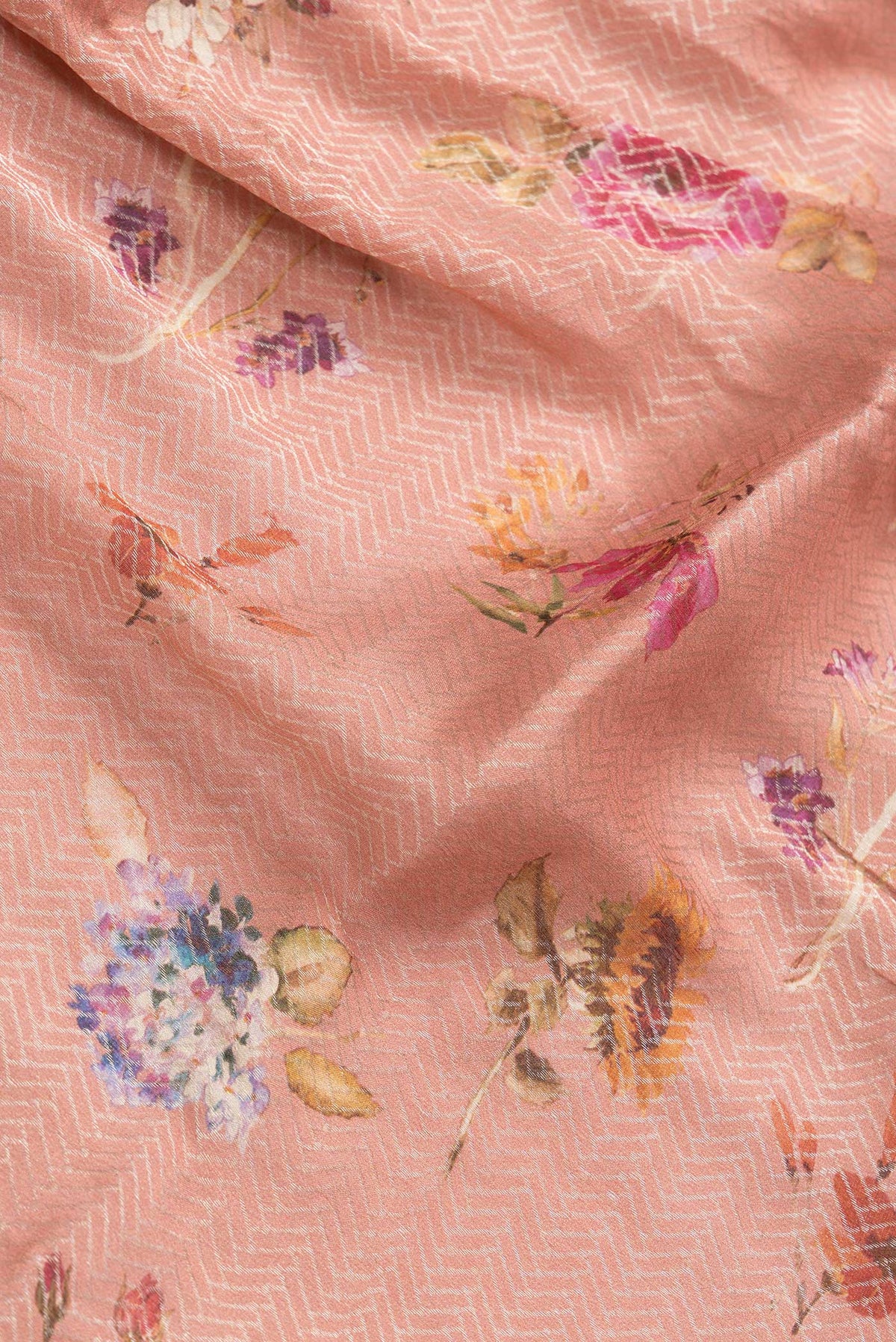 Close up of Peach Dual Tone Georgette Saree with Zari Brocade on the body and Zari Border.  displaying folds