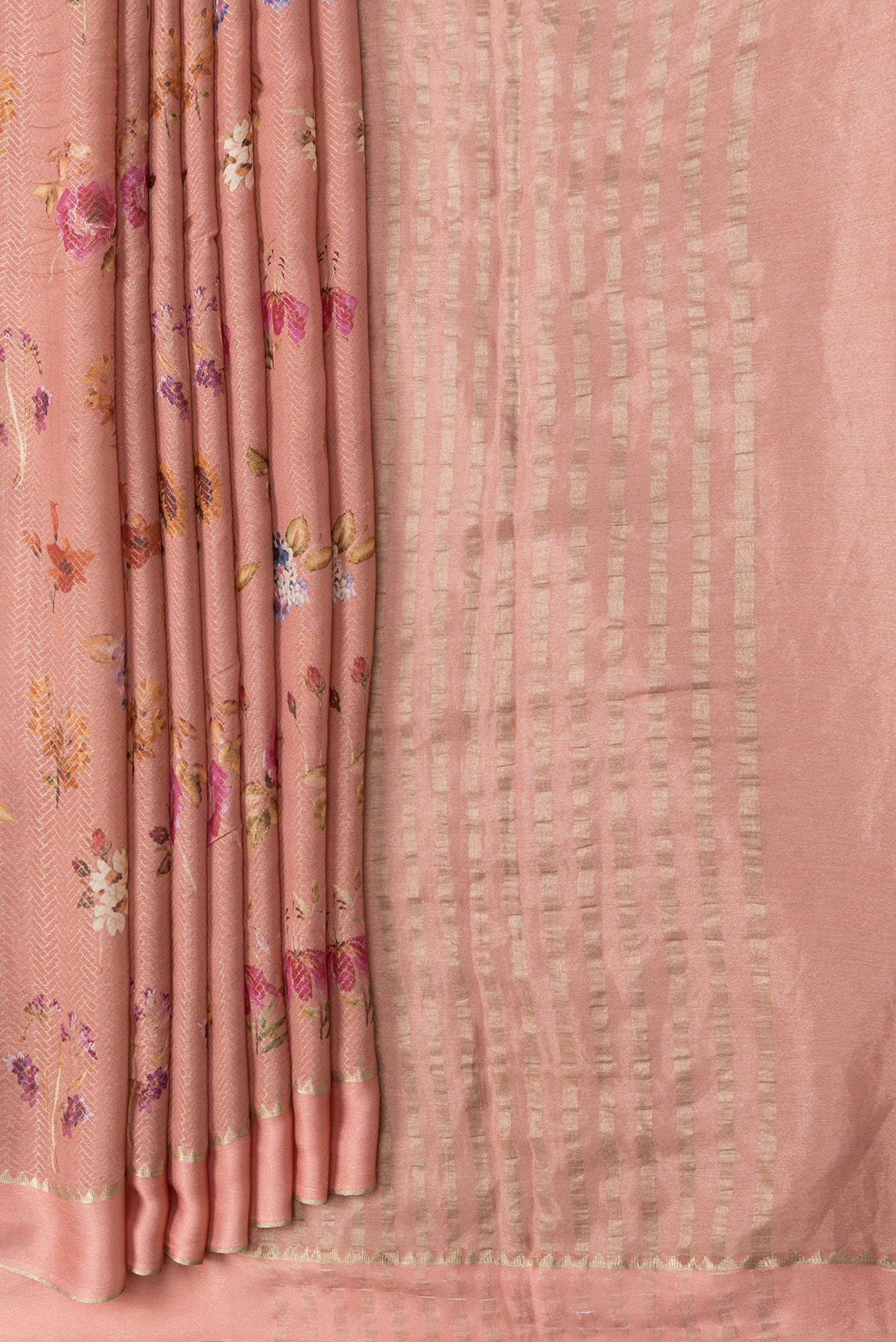 Pleats and pallu of Peach Dual Tone Georgette Saree with Zari Brocade on the body and Zari Border. 
