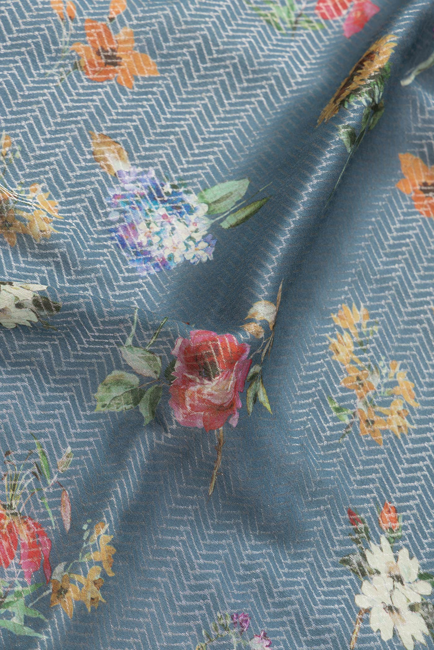 Close up of Grey Dual Tone Georgette Saree with Zari Brocade on the body and Zari Border.  displaying folds