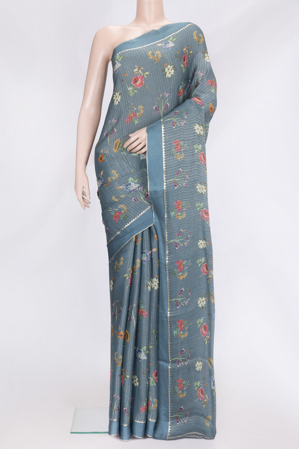 Grey Dual Tone Georgette Saree with Zari Brocade on the body and Zari Border.  displayed on a mannequin