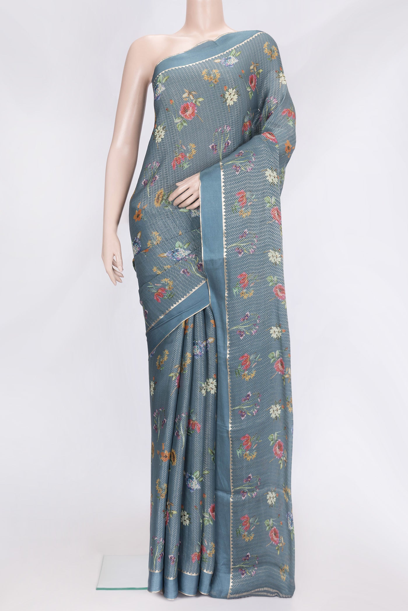 Grey Dual Tone Georgette Saree with Zari Brocade on the body and Zari Border.  displayed on a mannequin