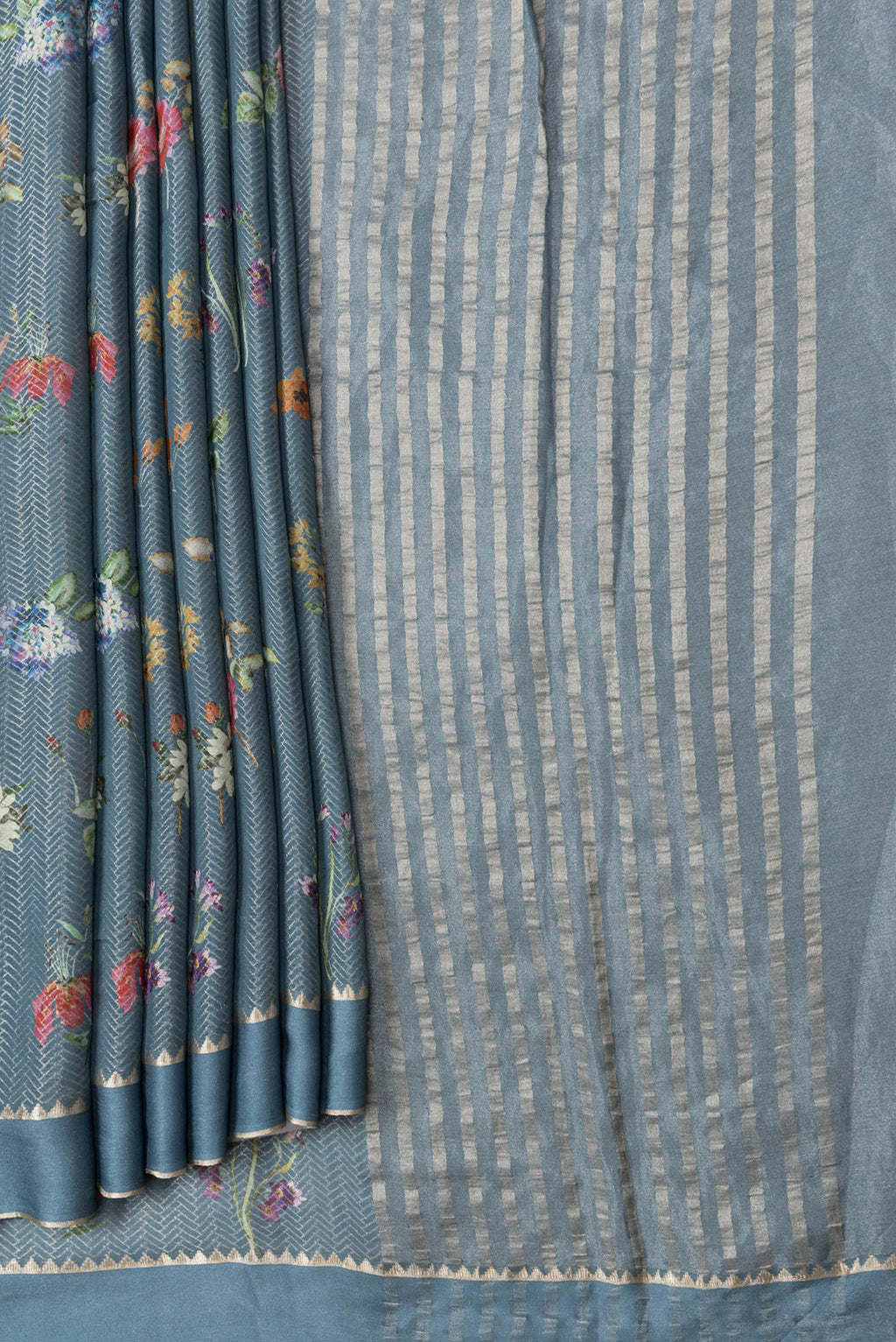 Pleats and pallu of Grey Dual Tone Georgette Saree with Zari Brocade on the body and Zari Border. 