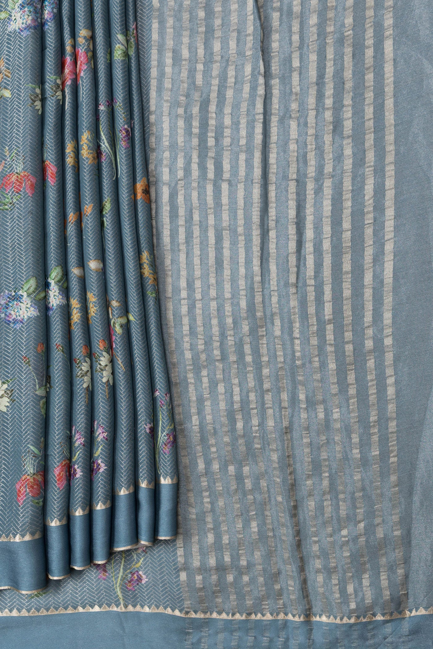 Pleats and pallu of Grey Dual Tone Georgette Saree with Zari Brocade on the body and Zari Border. 