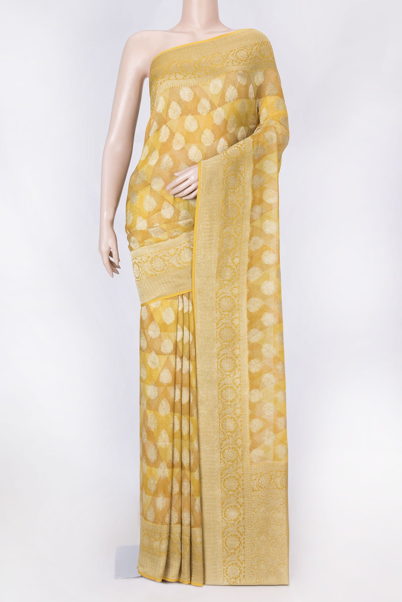 Mustard Dual Tone Georgette Saree with Printed design on the body and Zari Border displayed on a mannequin