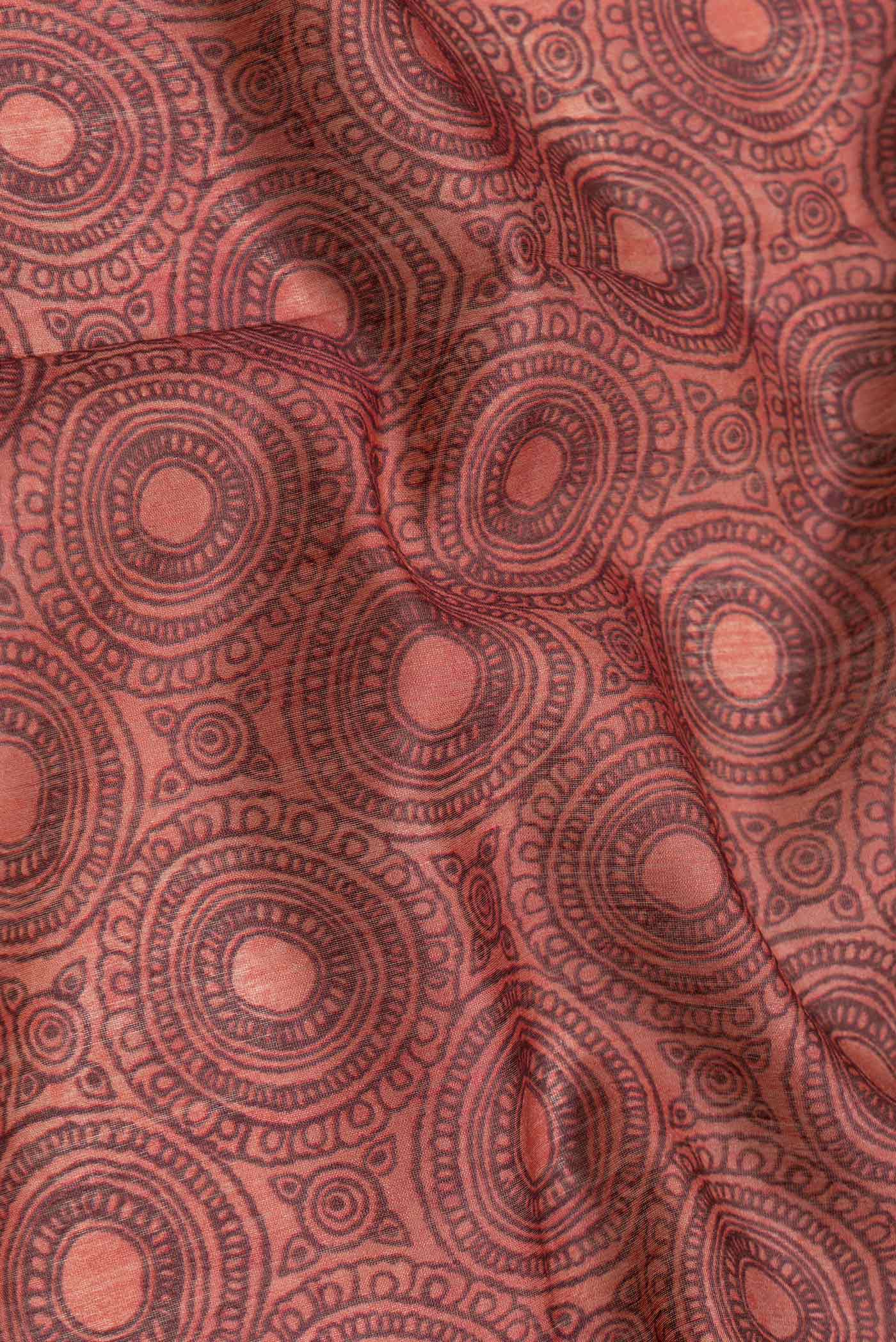 Close up of Maroon Dual Tone Tussar Silk Saree with Printed design on the body and Embroidery Border.  displaying folds