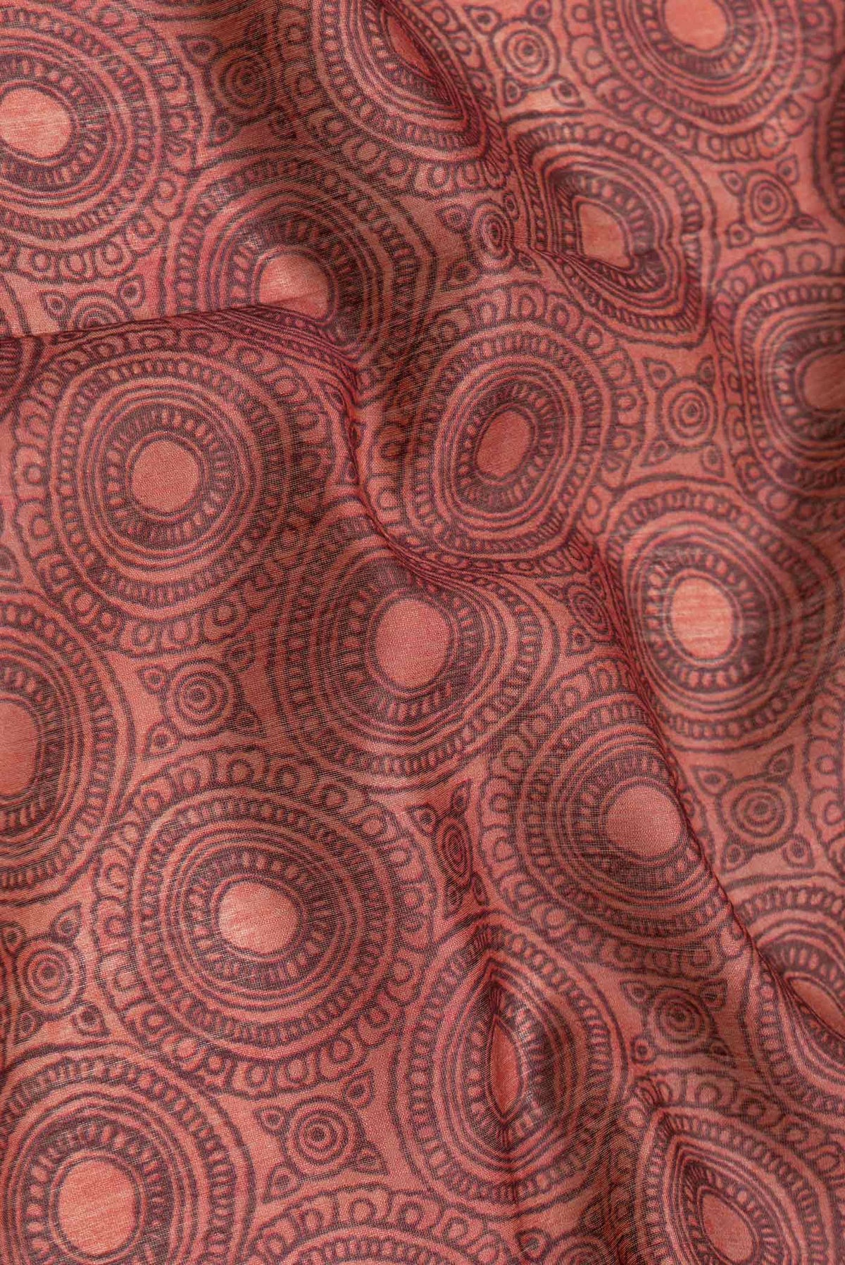 Close up of Maroon Dual Tone Tussar Silk Saree with Printed design on the body and Embroidery Border.  displaying folds