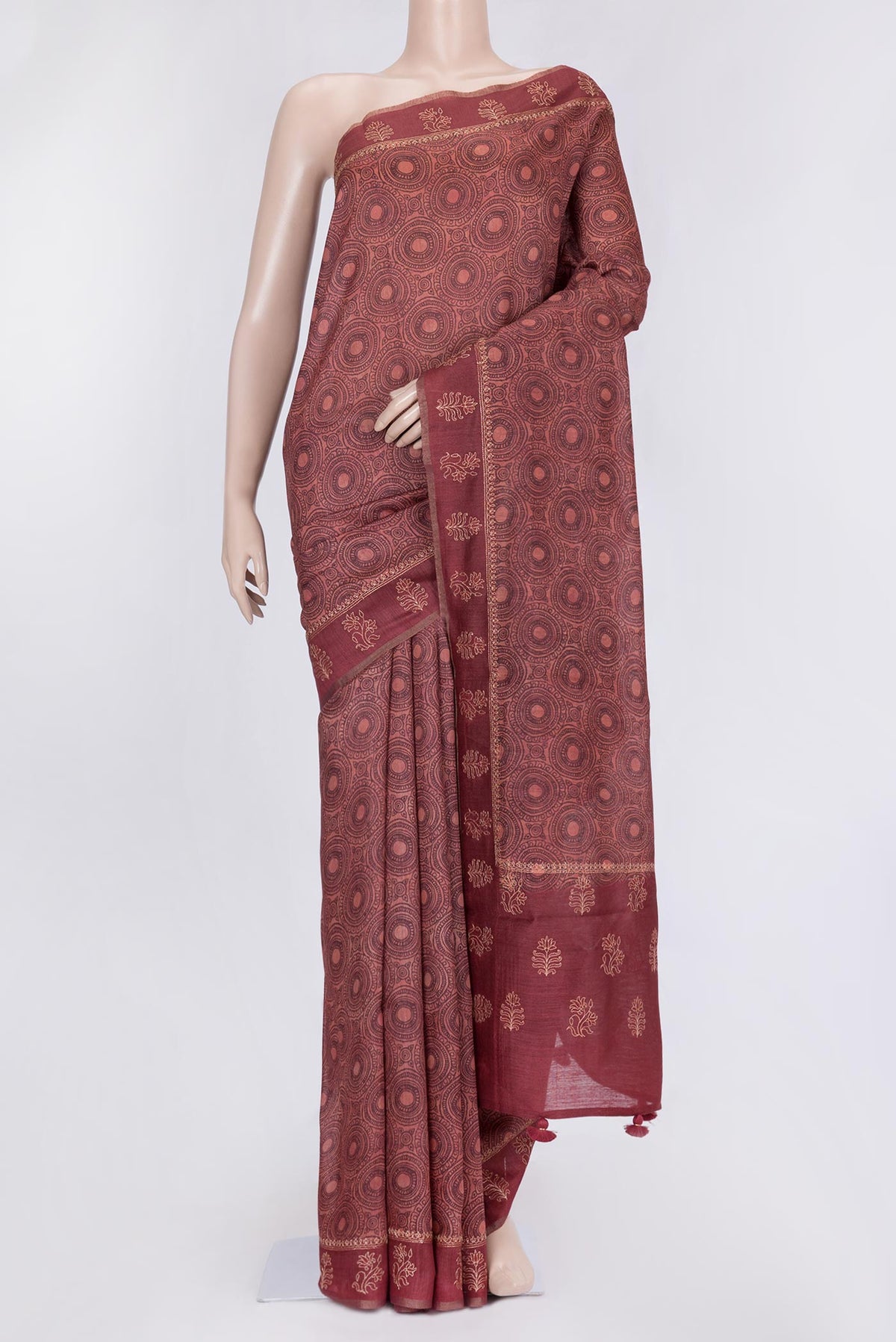Maroon Dual Tone Tussar Silk Saree with Printed design on the body and Embroidery Border.  displayed on a mannequin