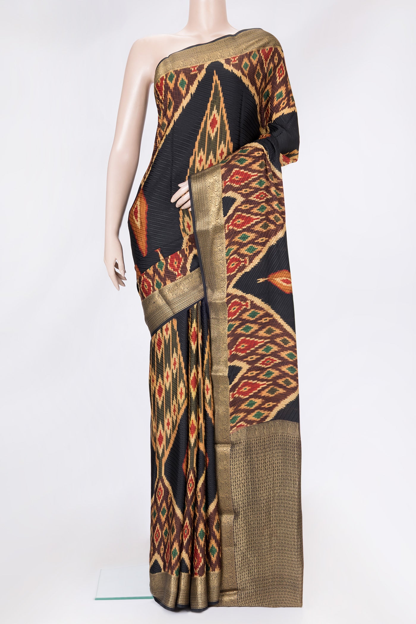 Black Dual Tone Mysore Crepe Saree with Printed design on the body and Zari Border.  displayed on a mannequin