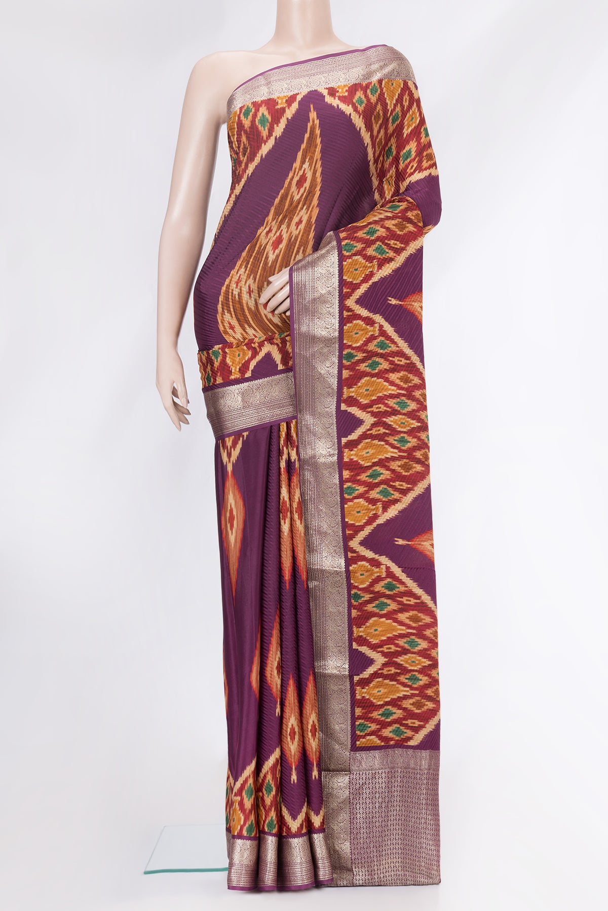 Purple Mysore Crepe Saree with Printed design on the body and Zari Border.  displayed on a mannequin