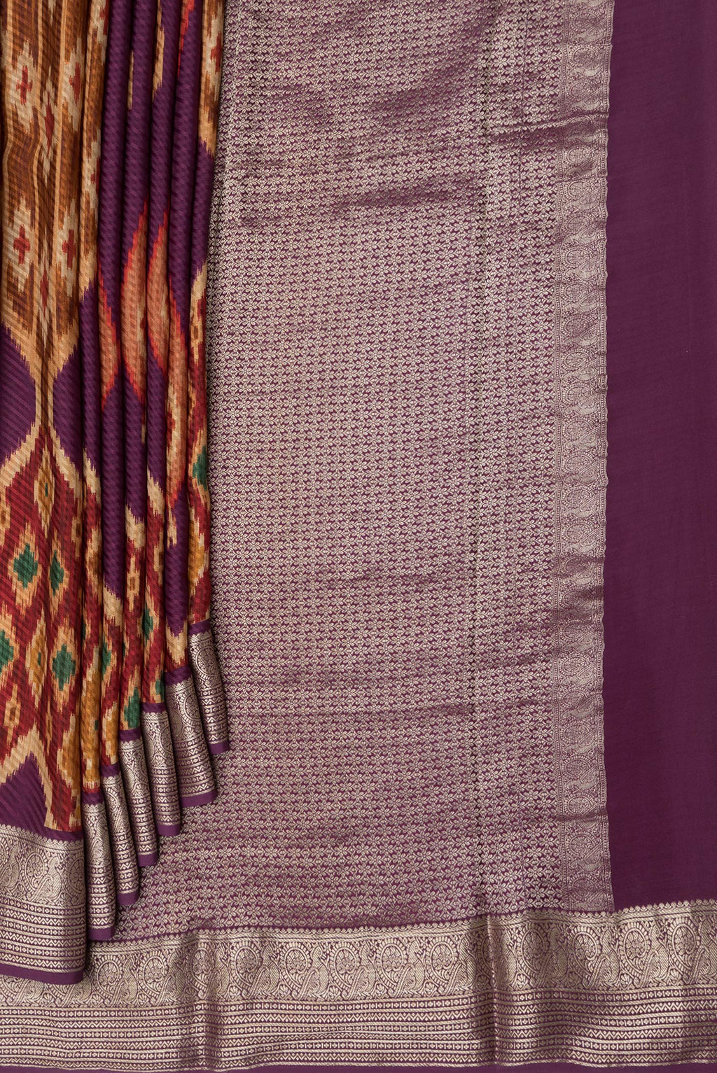 Pleats and pallu of Purple Mysore Crepe Saree with Printed design on the body and Zari Border. 