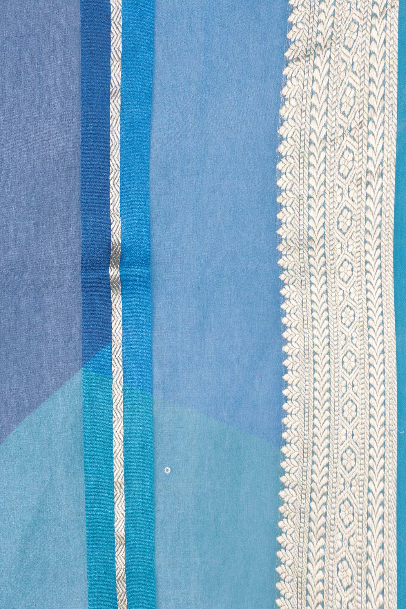 Border image of Peacock Blue Dual Tone Mysore Georgette Saree with Stripes on the body and Zari Border. 