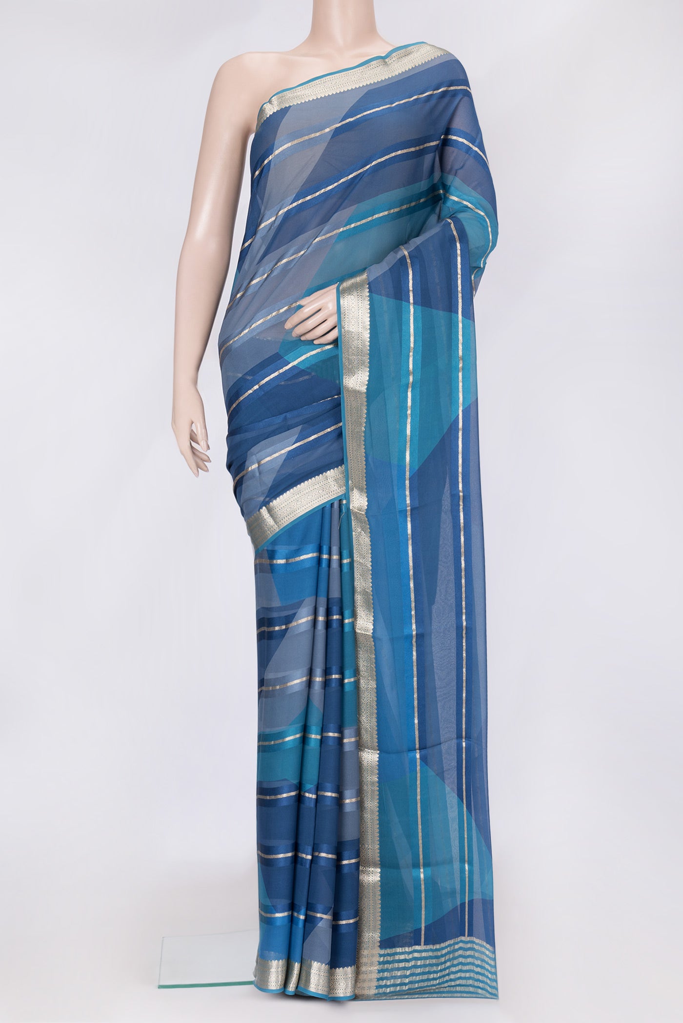 Peacock Blue Dual Tone Mysore Georgette Saree with Stripes on the body and Zari Border.  displayed on a mannequin