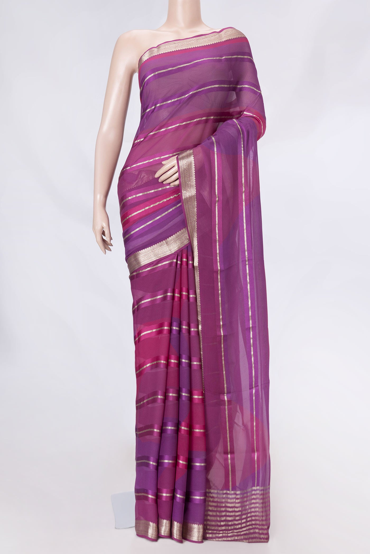 Multi Color Mysore Georgette Saree with Stripes on the body and Zari Border displayed on a mannequin