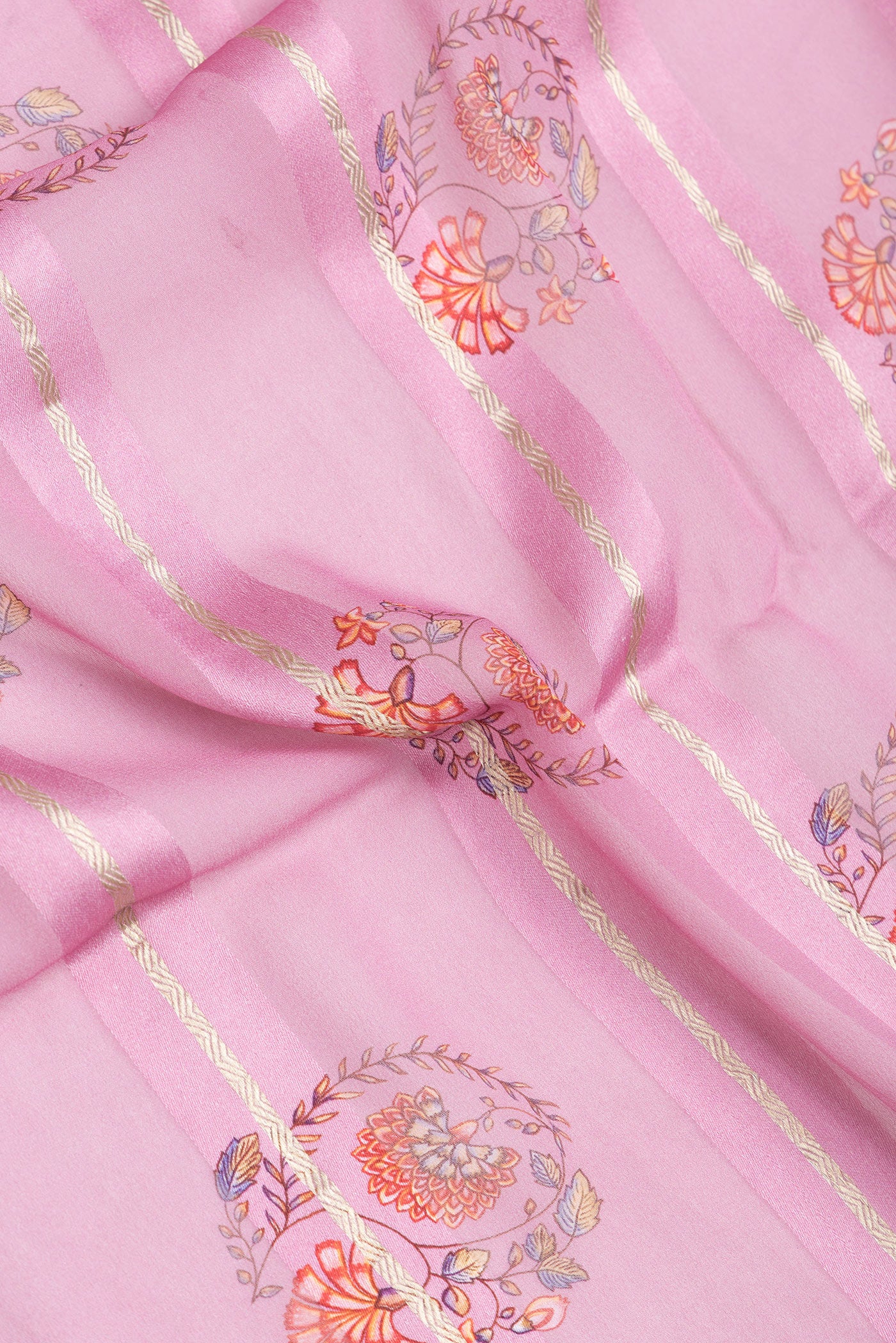 Close up of Pink Dual Tone Mysore Georgette Saree with Printed design on the body and Zari Border.  displaying folds
