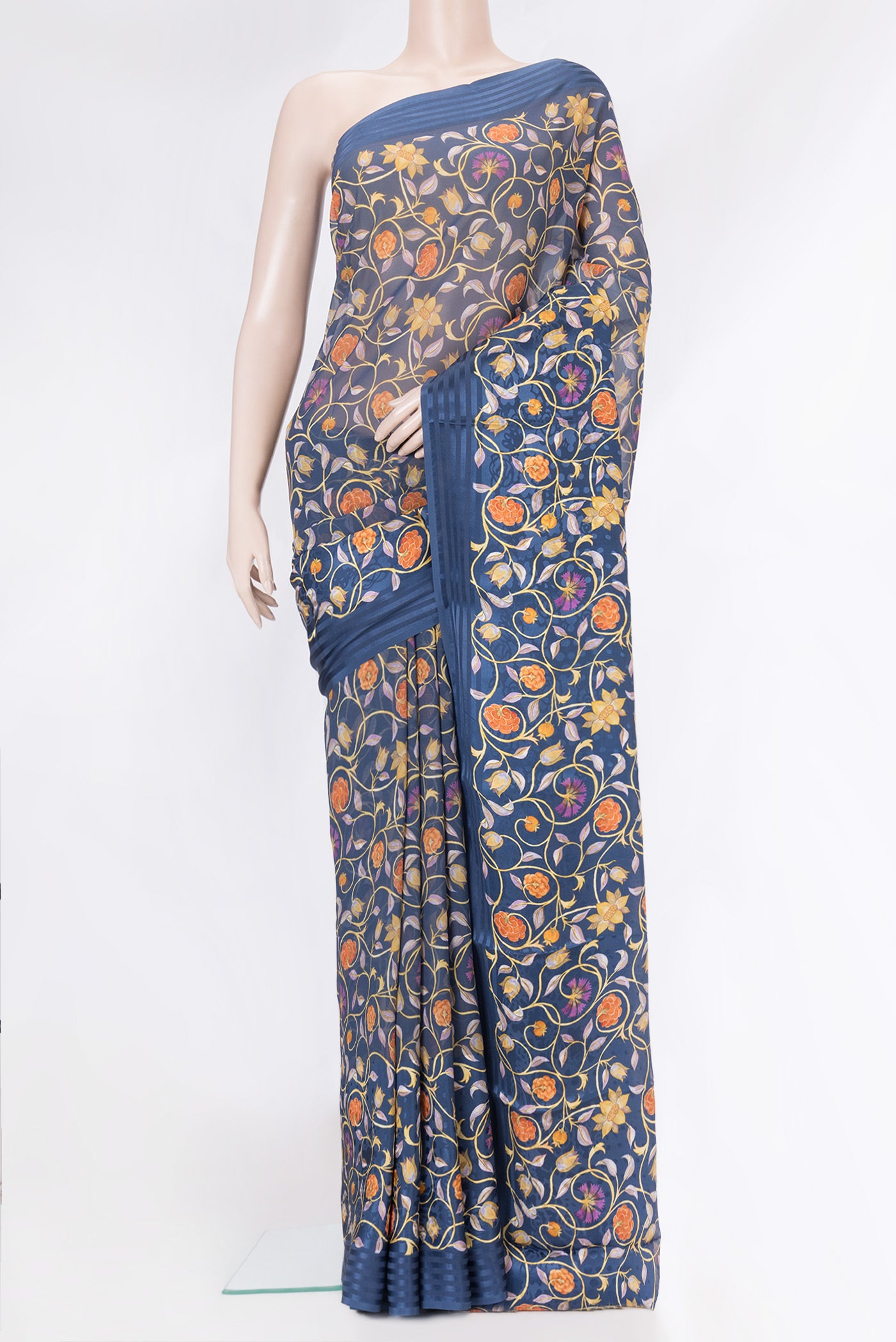 Navy Blue Dual Tone Mysore Crepe Saree with Printed design on the body and Thread Border.  displayed on a mannequin