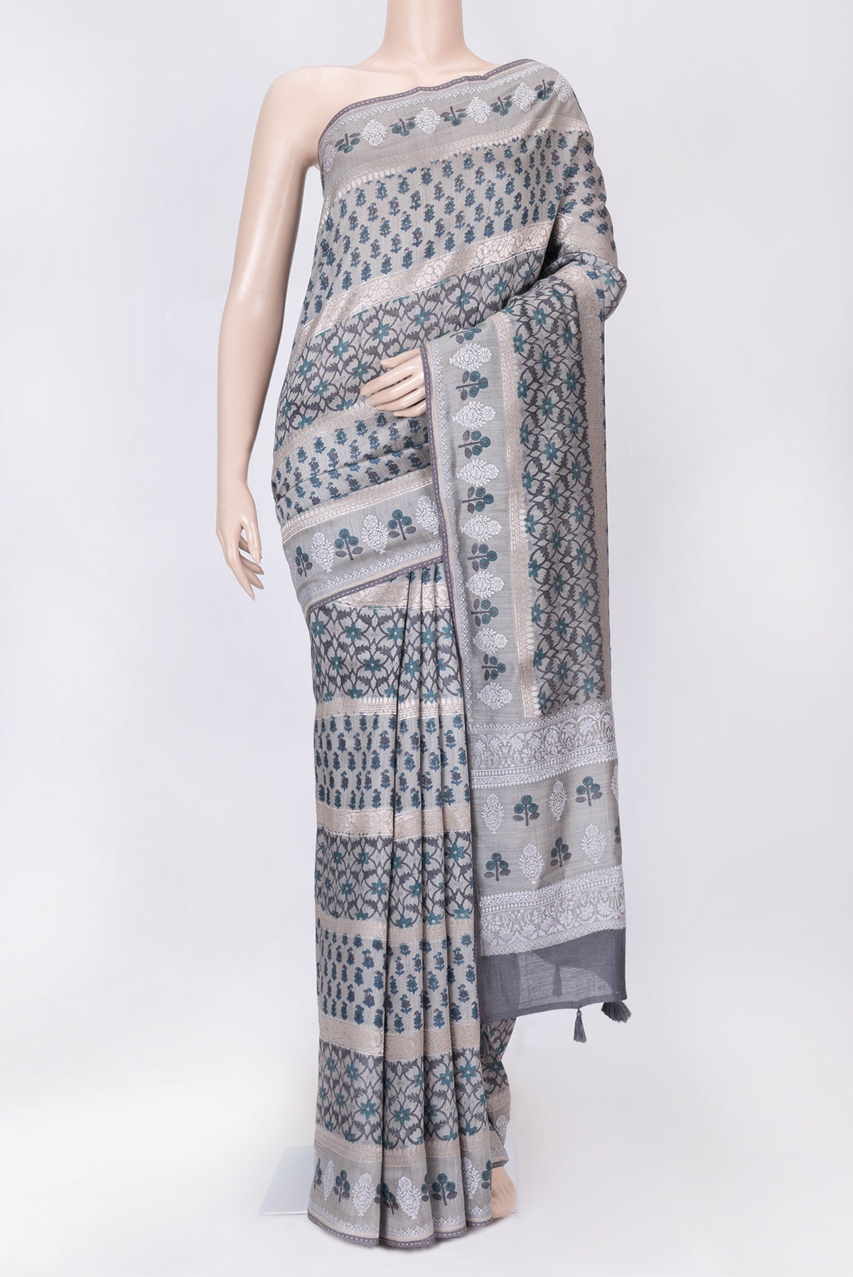Grey Dual Tone Tussar Silk Saree with Printed design on the body and Embroidery Border displayed on a mannequin
